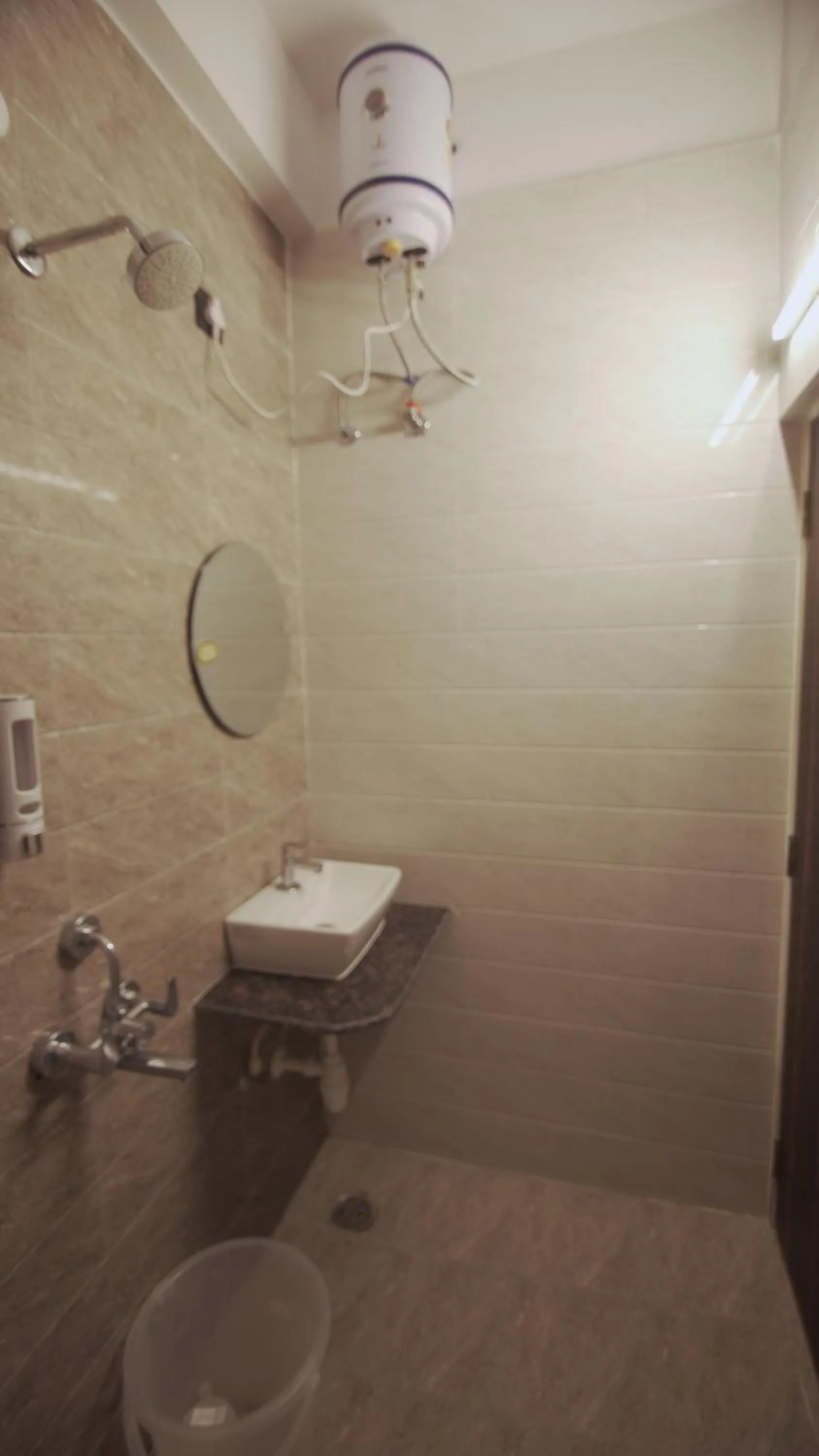 Shower in Radhe Suites