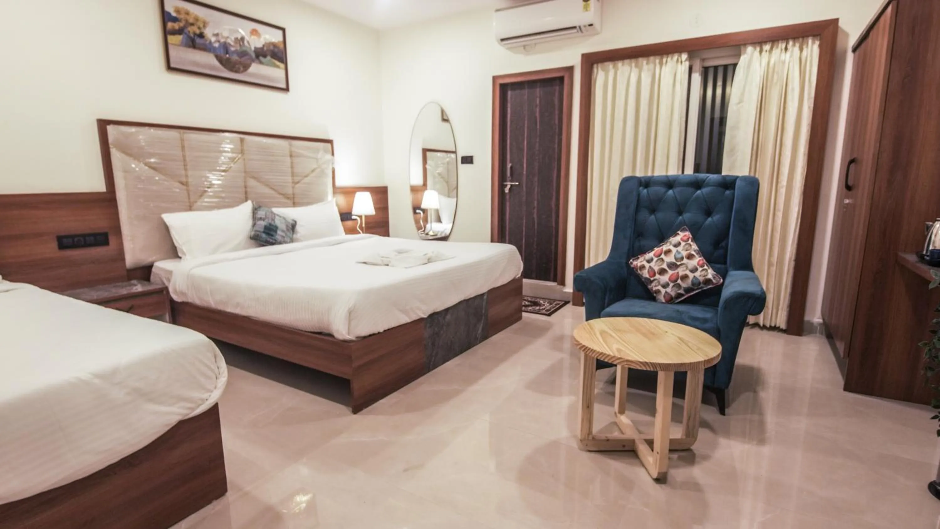 Living room, Bed in Radhe Suites