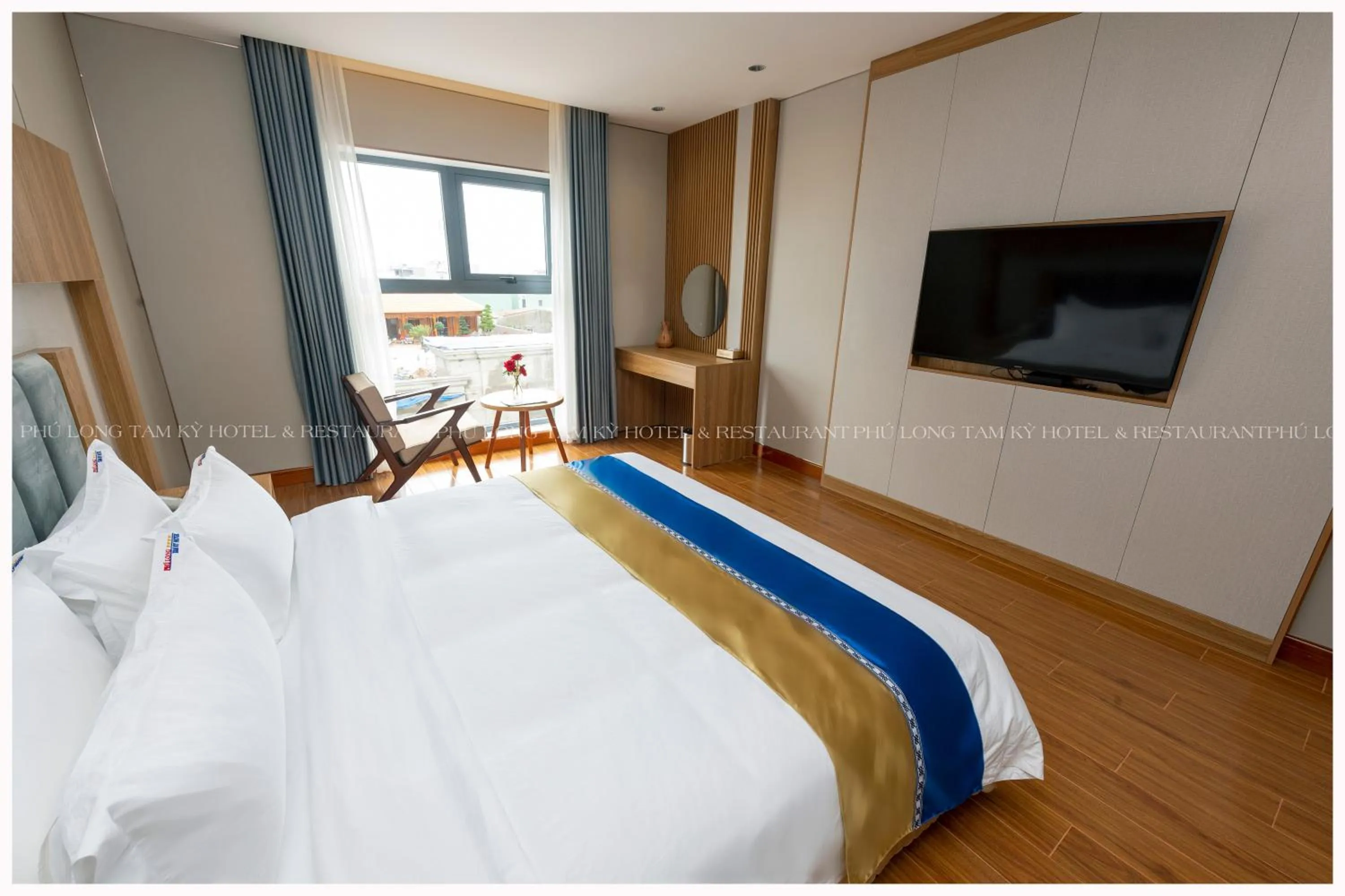 Bed in Phú Long Tam Kỳ Hotel & Restaurant