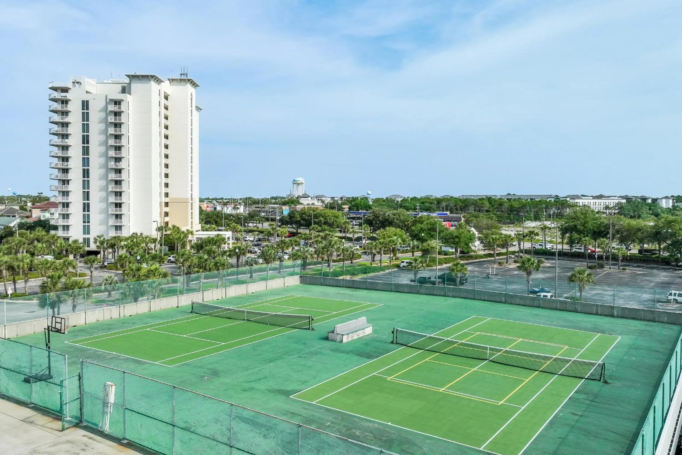 Tennis court, Swimming Pool in Pelican Beach Resort by Colasan