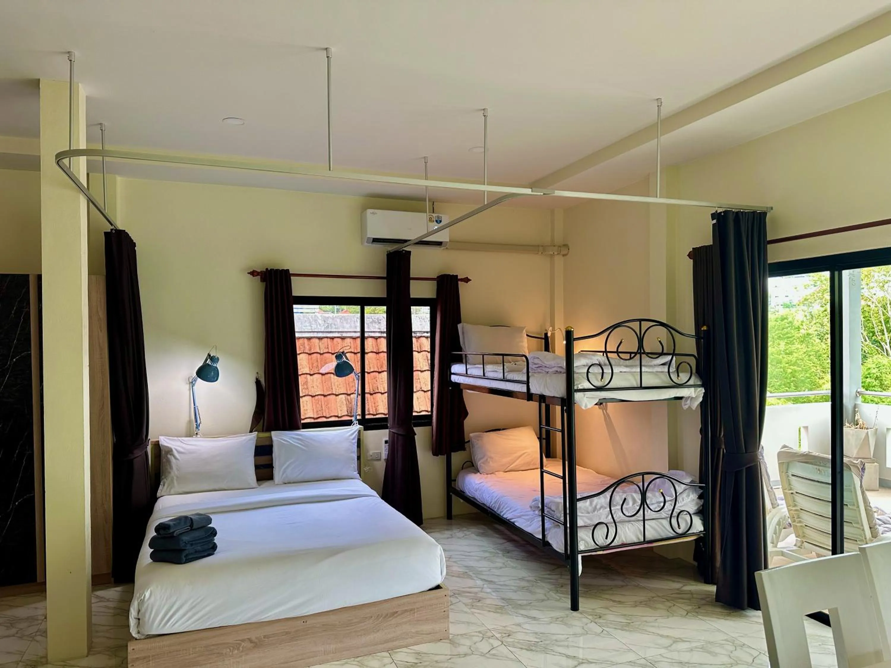 Bed in M&N Guesthouse Kata