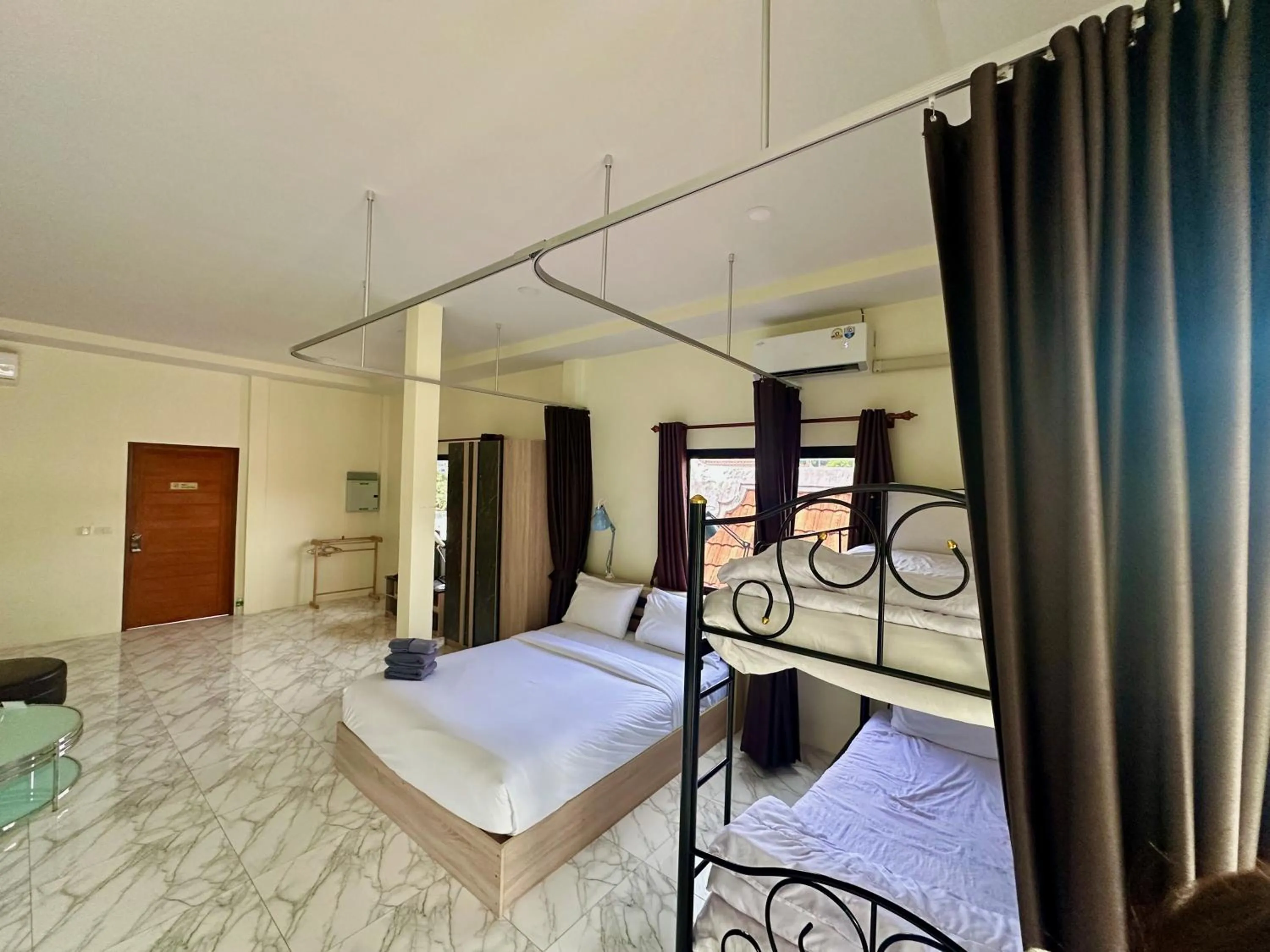 Bed in M&N Guesthouse Kata