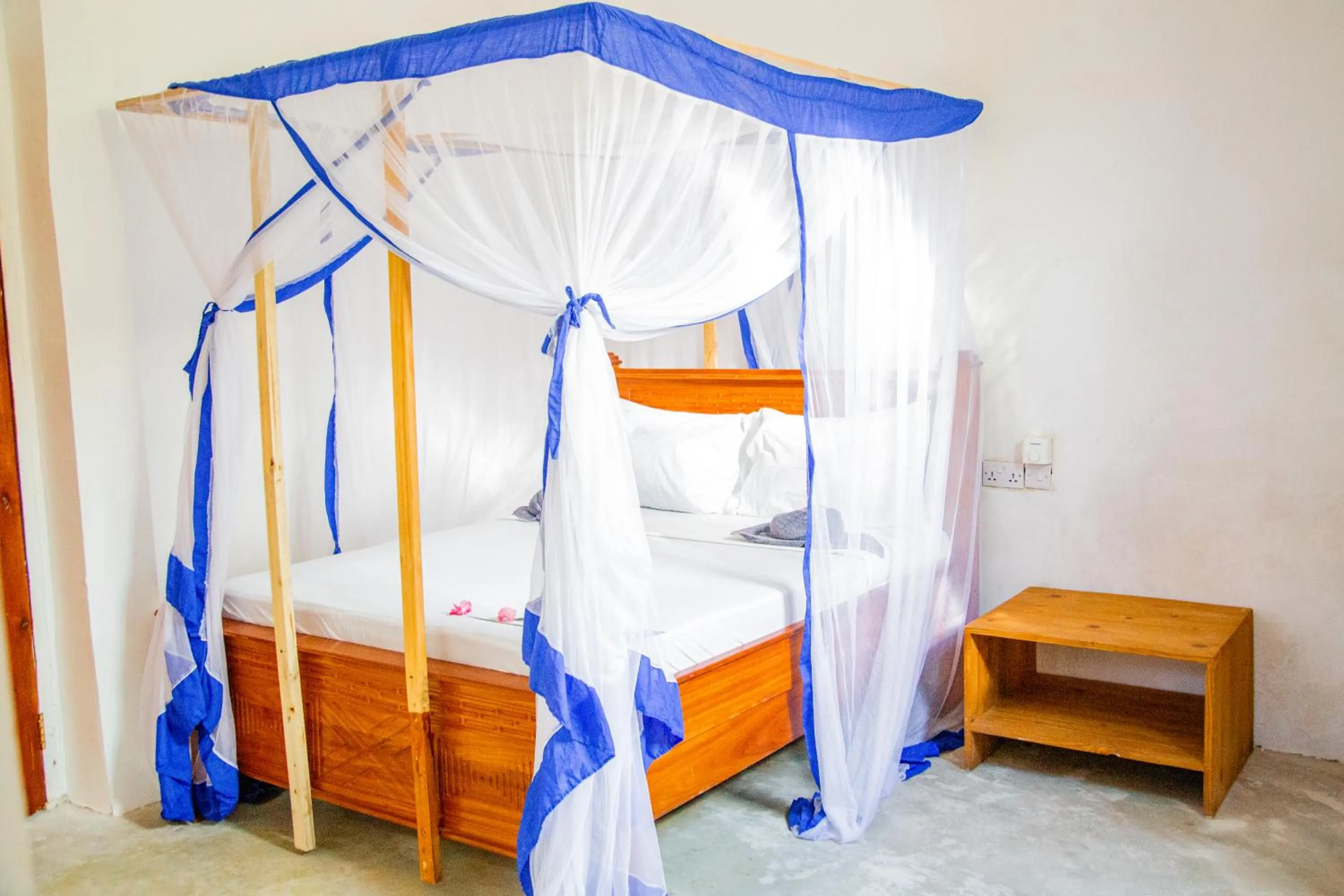Photo of the whole room, Bed in Pamoja Beach Stays Hotel in Jambiani