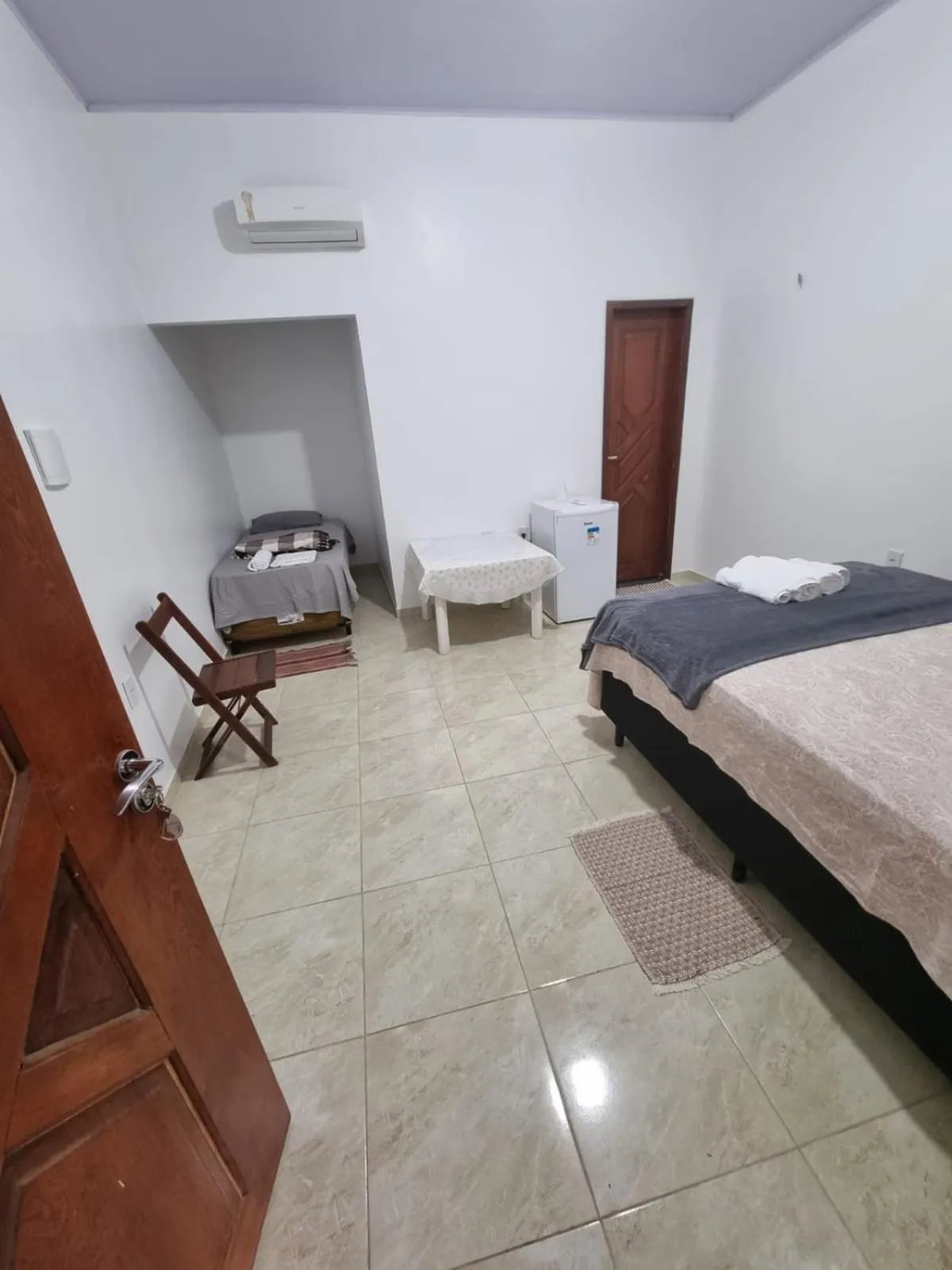 Bed in Pousada Talismã