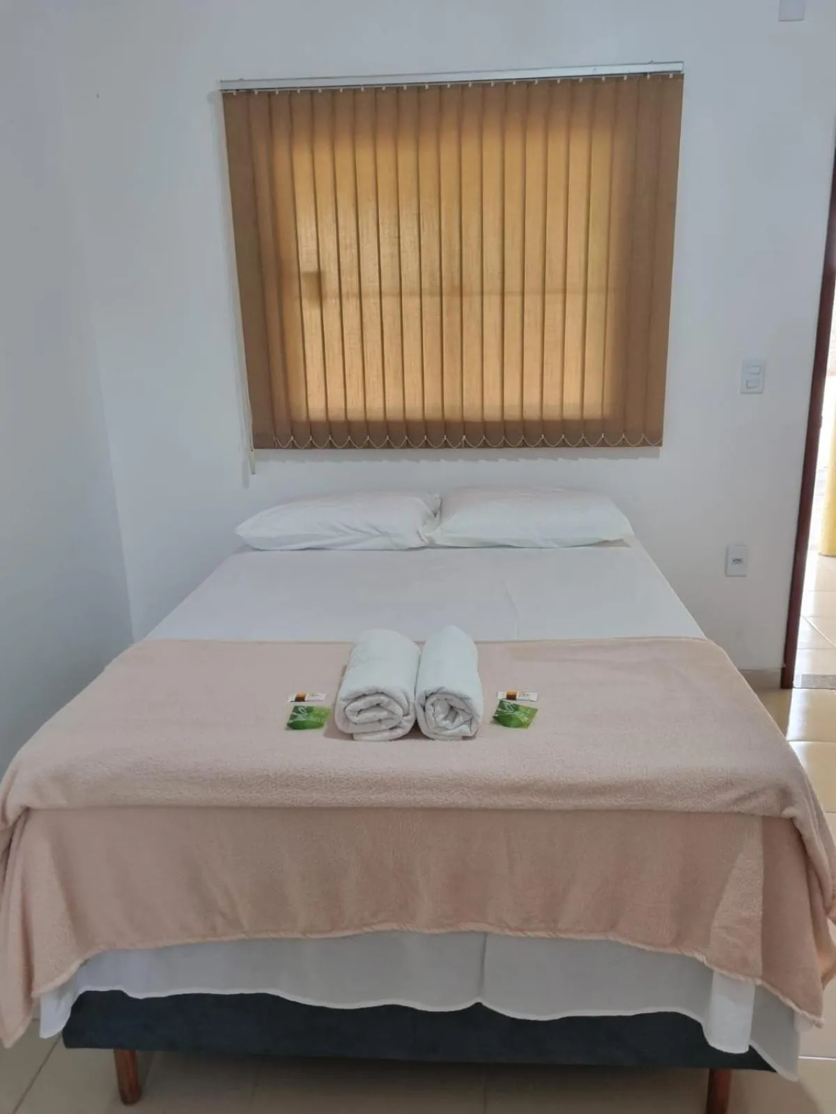 Bed in Pousada Talismã