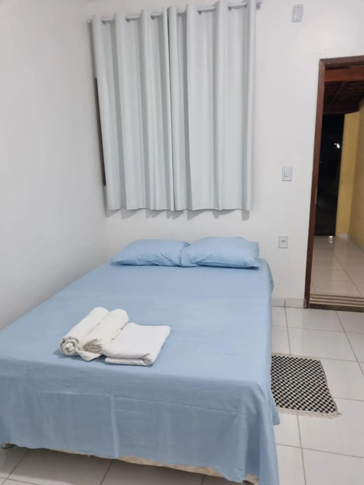 Bed in Pousada Talismã