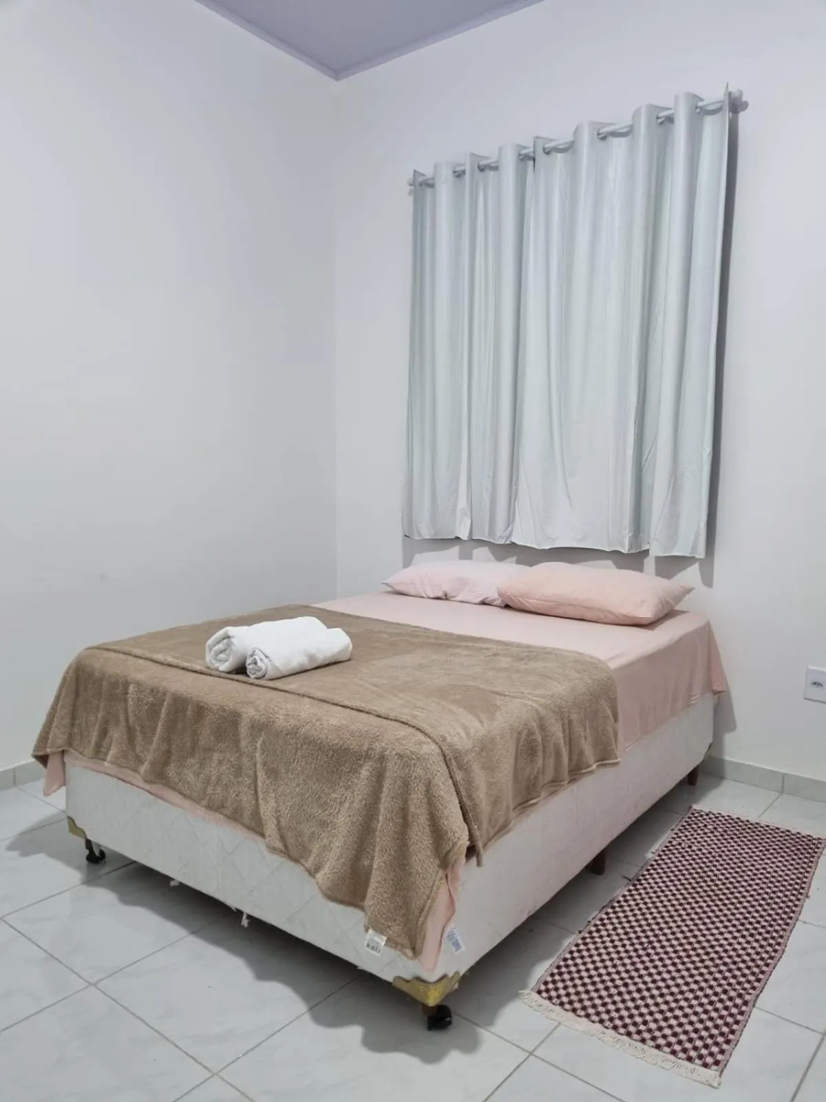 Bed in Pousada Talismã