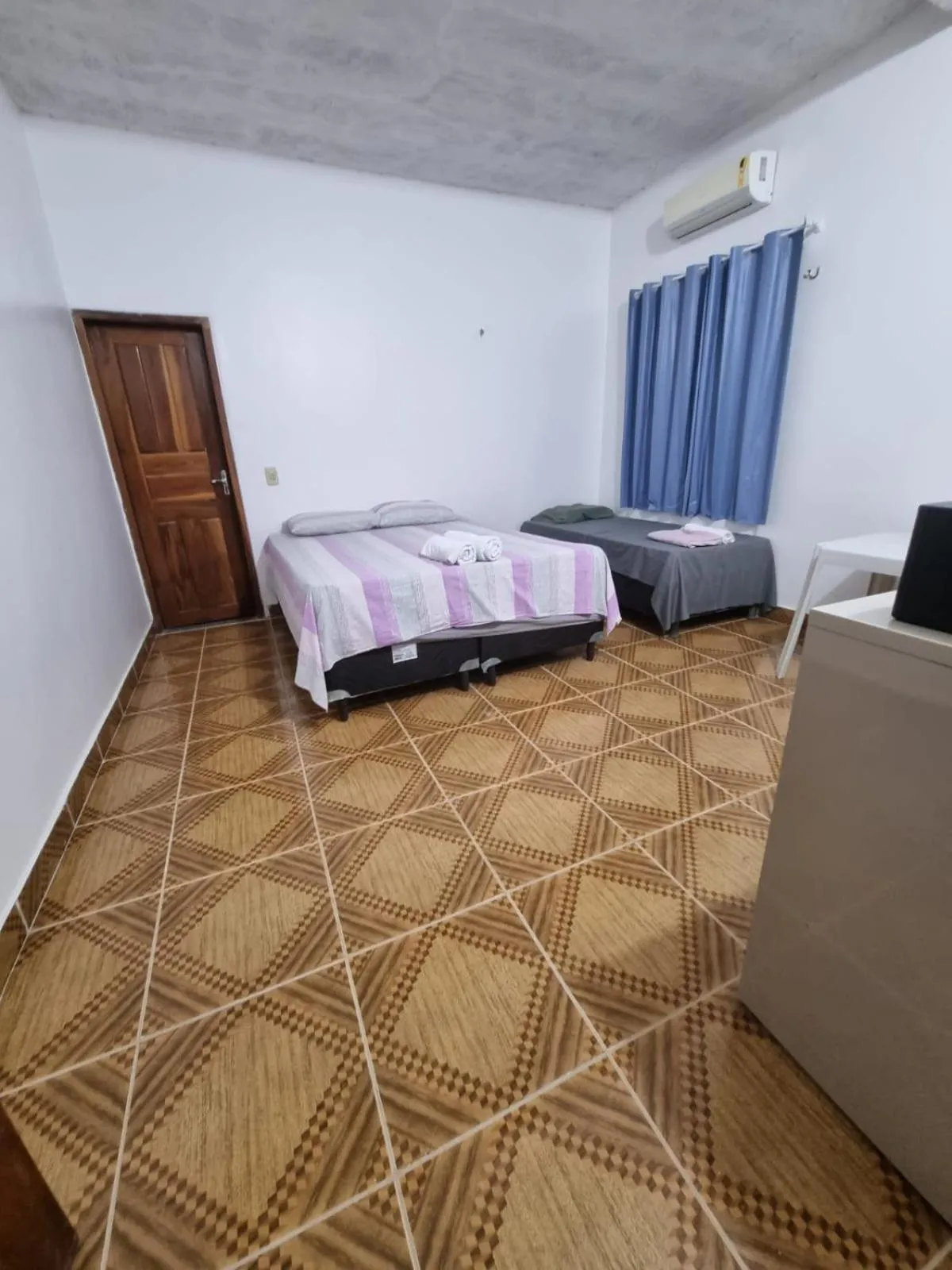 Bed in Pousada Talismã