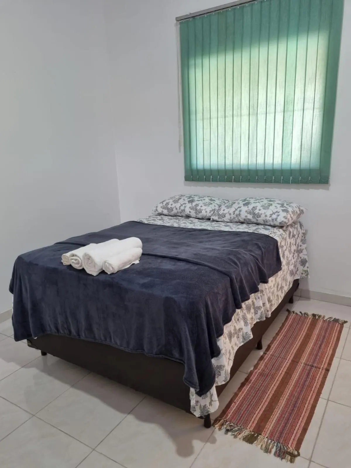 Bed in Pousada Talismã