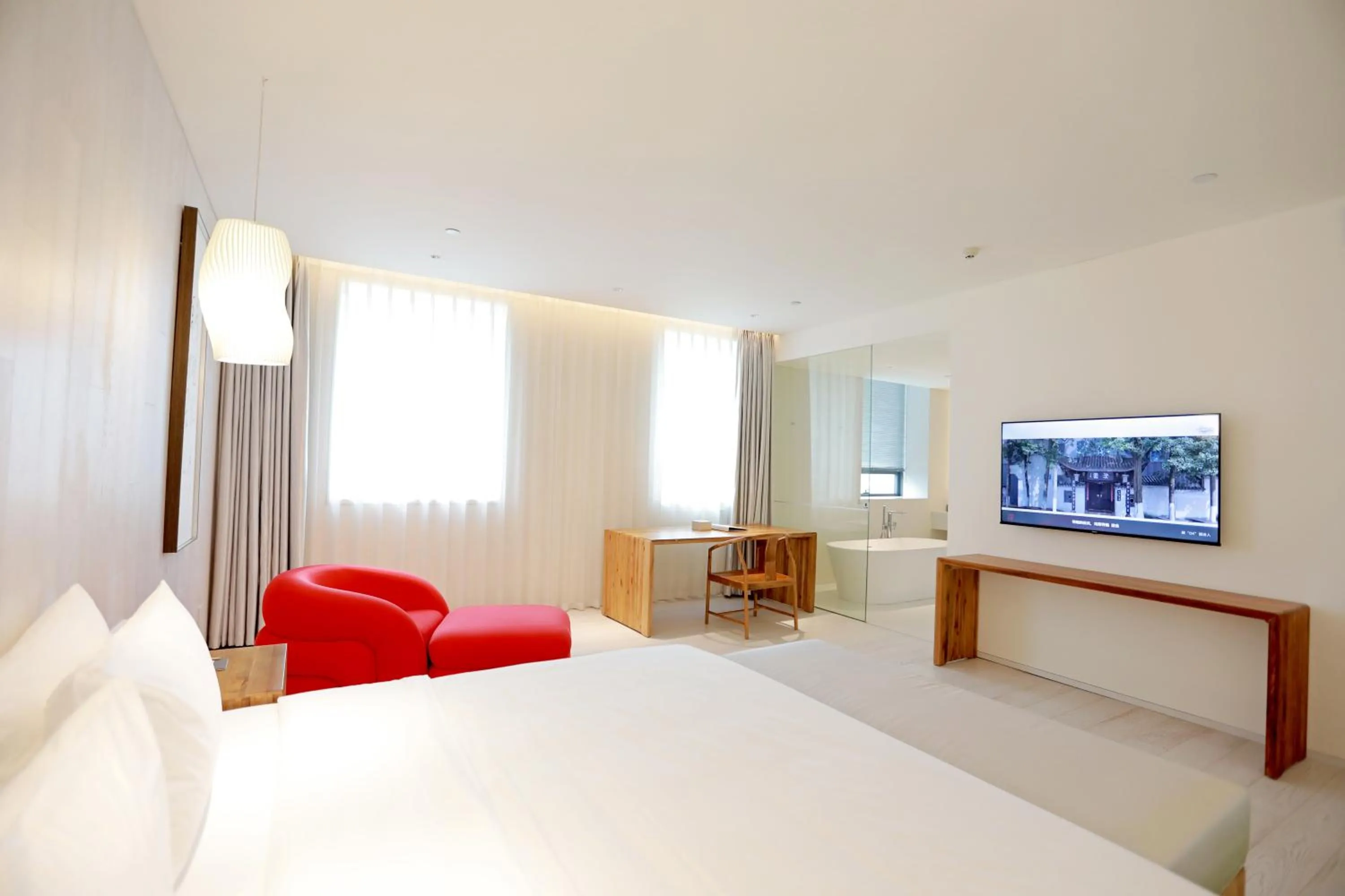 Communal lounge/ TV room, Bed in Chengdu Chengshe Hotel - Wenjiang University Town Southwest Caida Branch