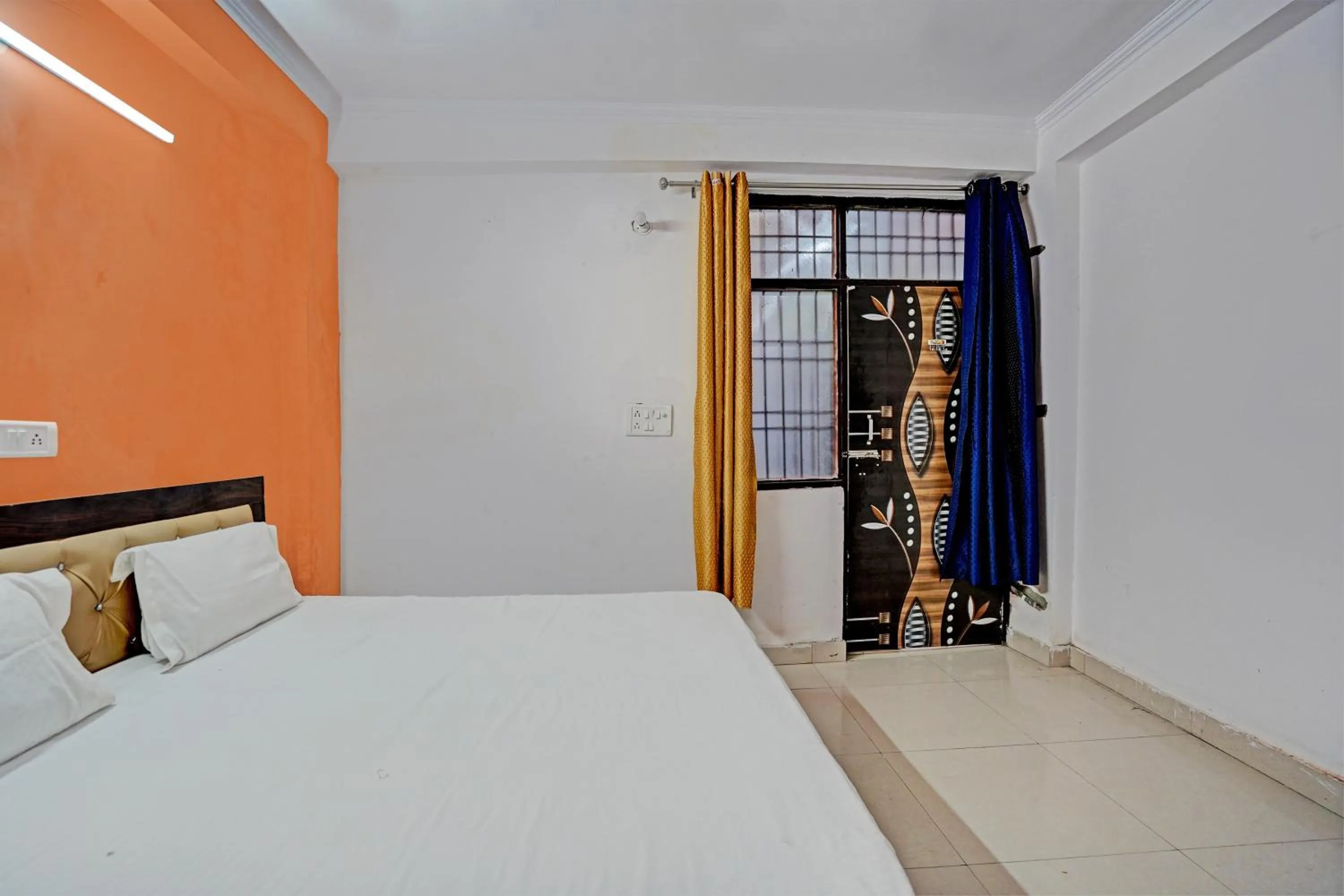 Bedroom in Hotel O Krishna Residency