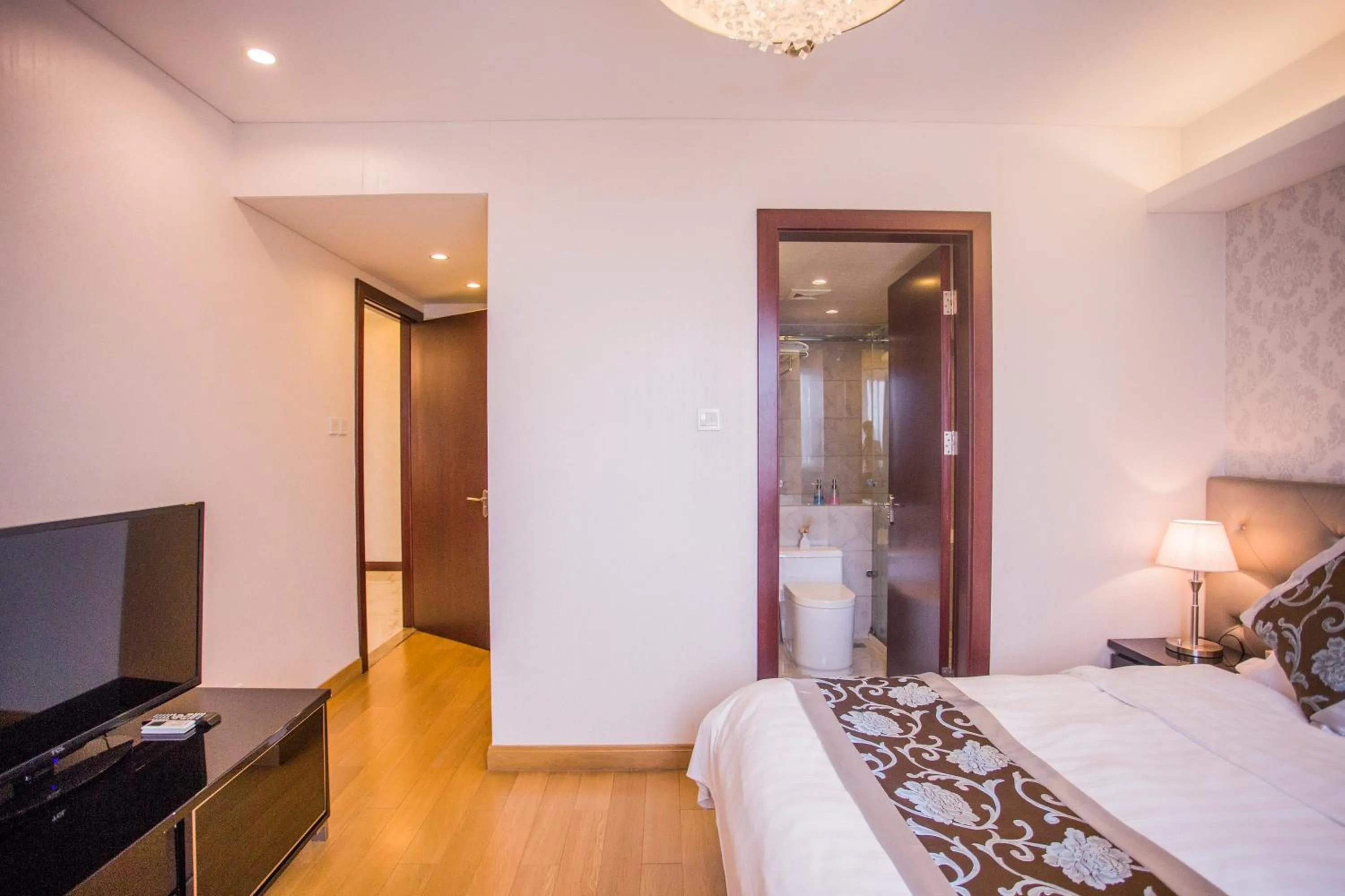 Bed in Guangyao Service Apartment Beijing Ritan