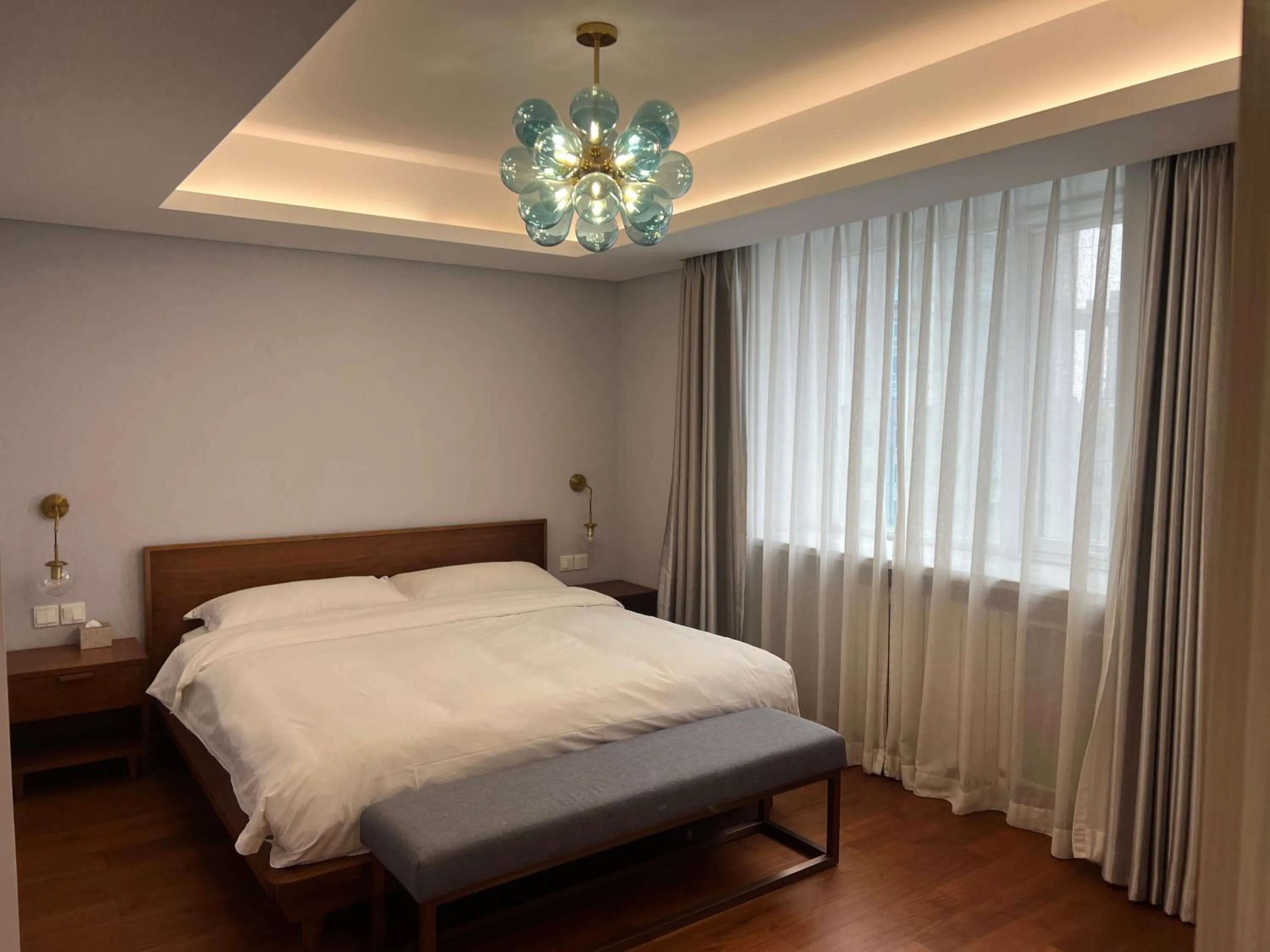 Bed in Guangyao Service Apartment Beijing Ritan