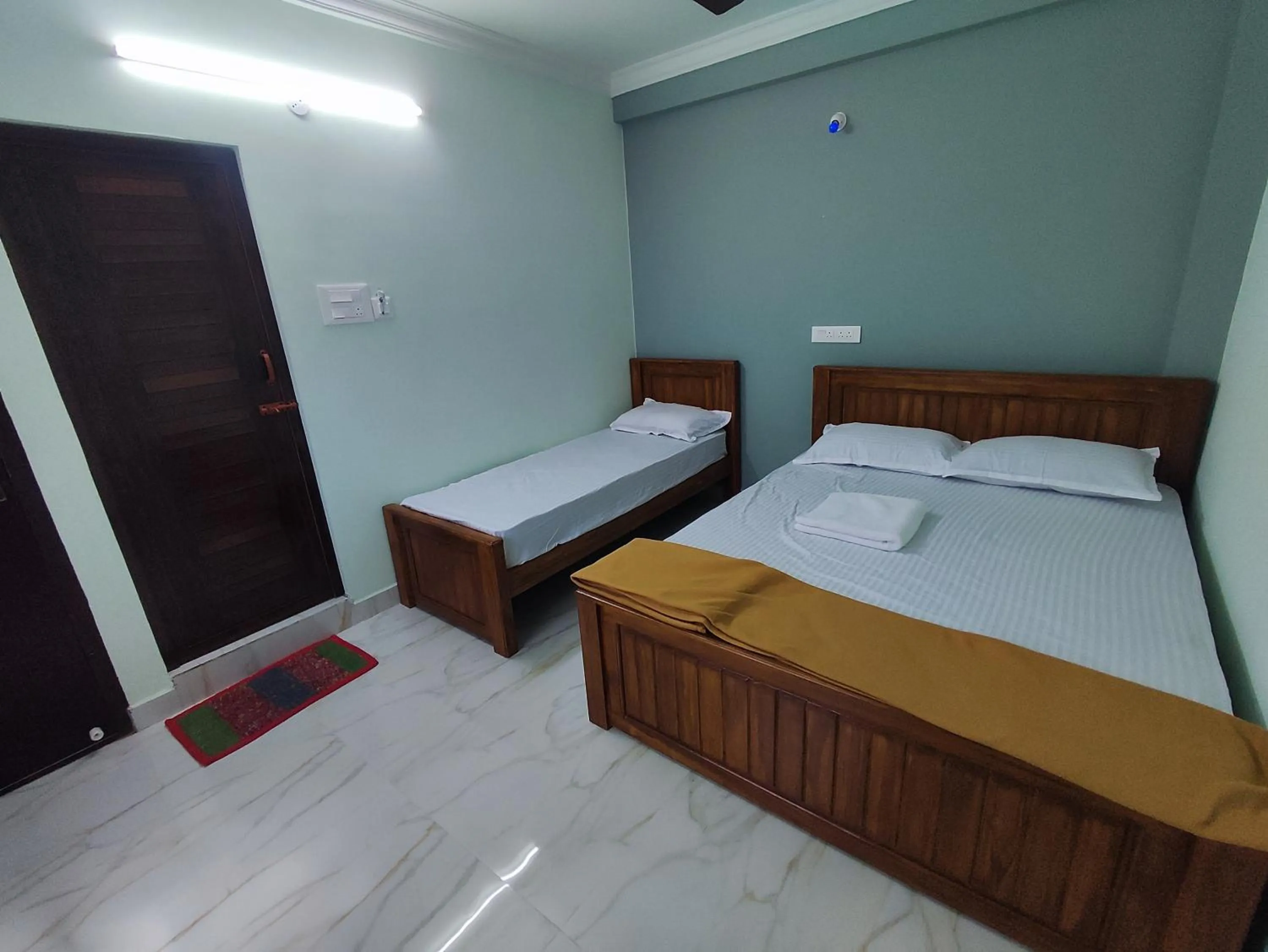 Bed in Sri Aksha Residency