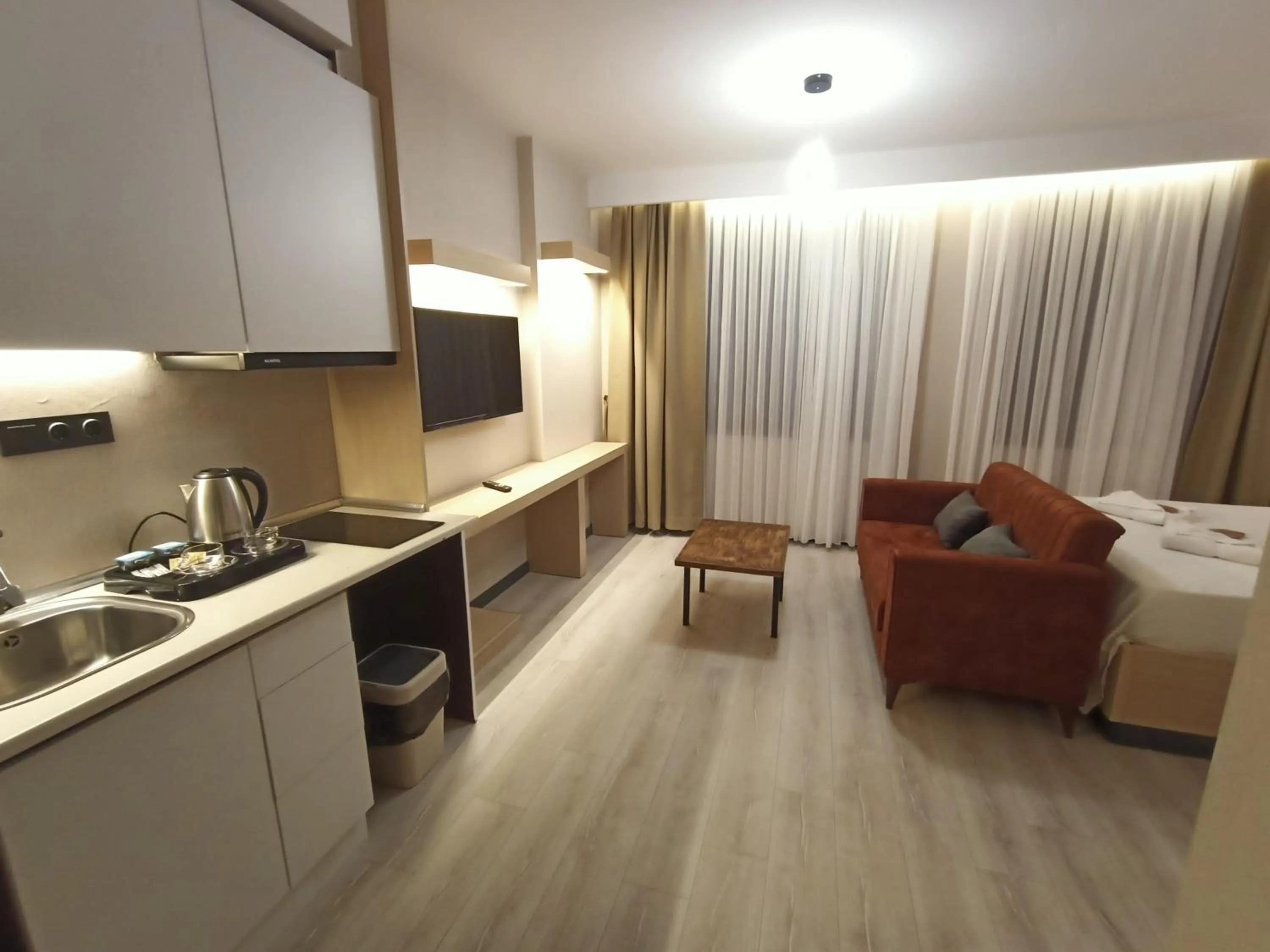 Living room, Bed in NEW FALCON Palas OTEL