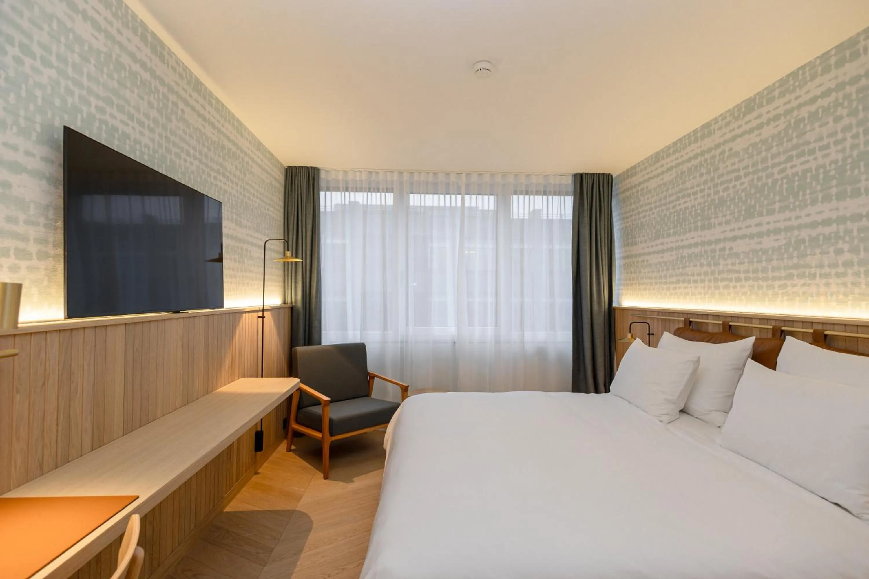 Bed in The Yarn Design & Business Hotel