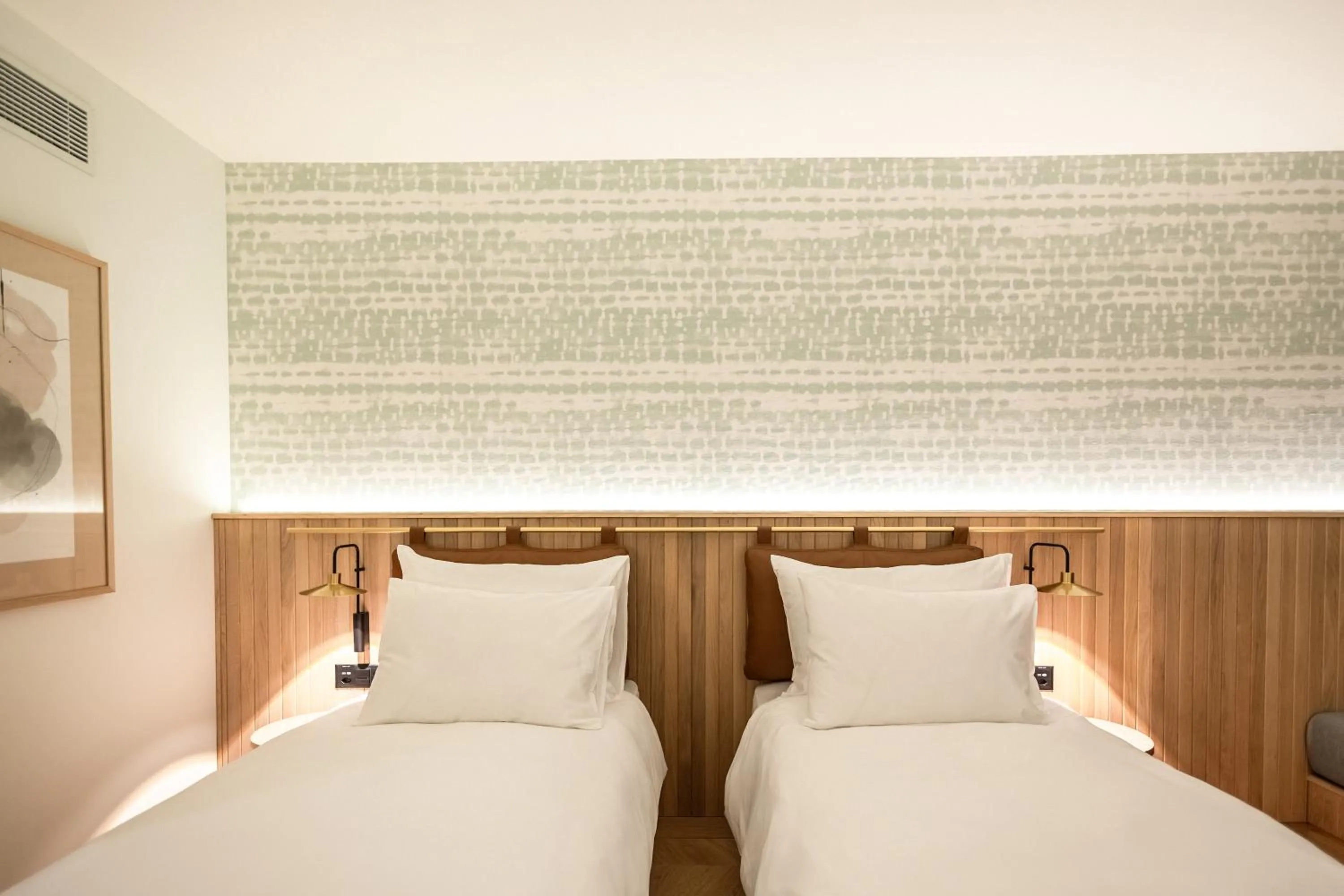 Bed in The Yarn Design & Business Hotel