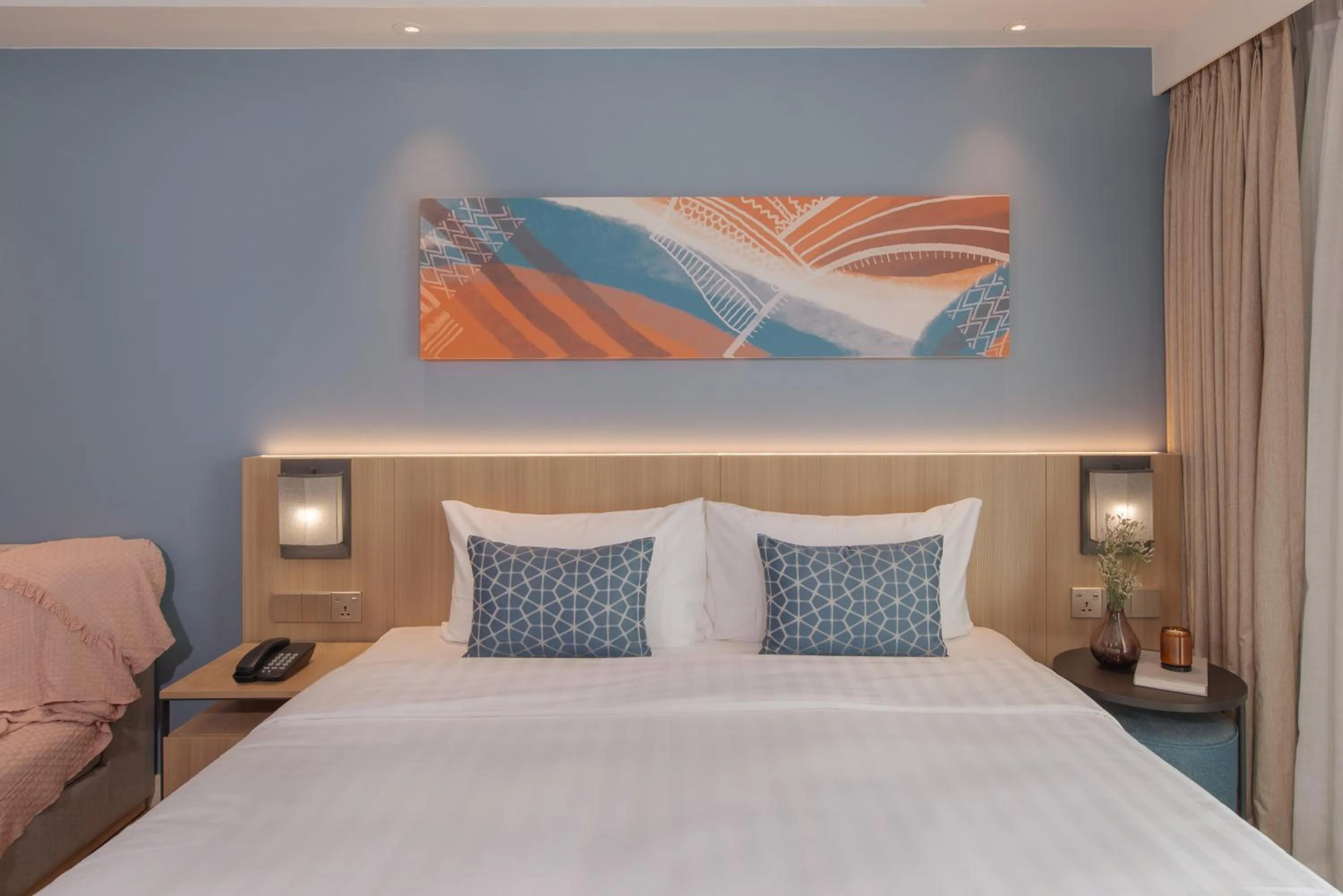 Bed in Citadines Roces Quezon City