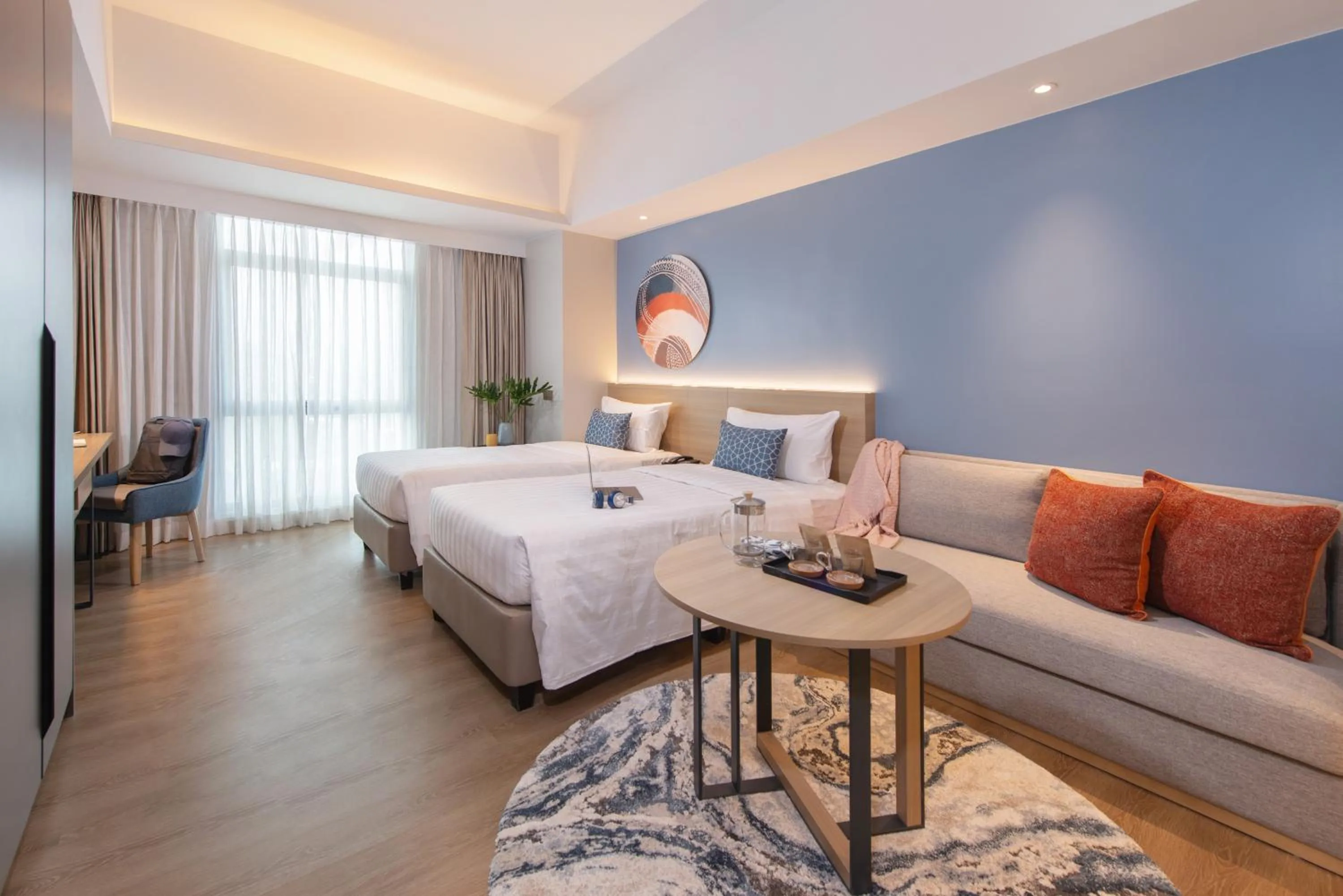 Seating area, Bed in Citadines Roces Quezon City