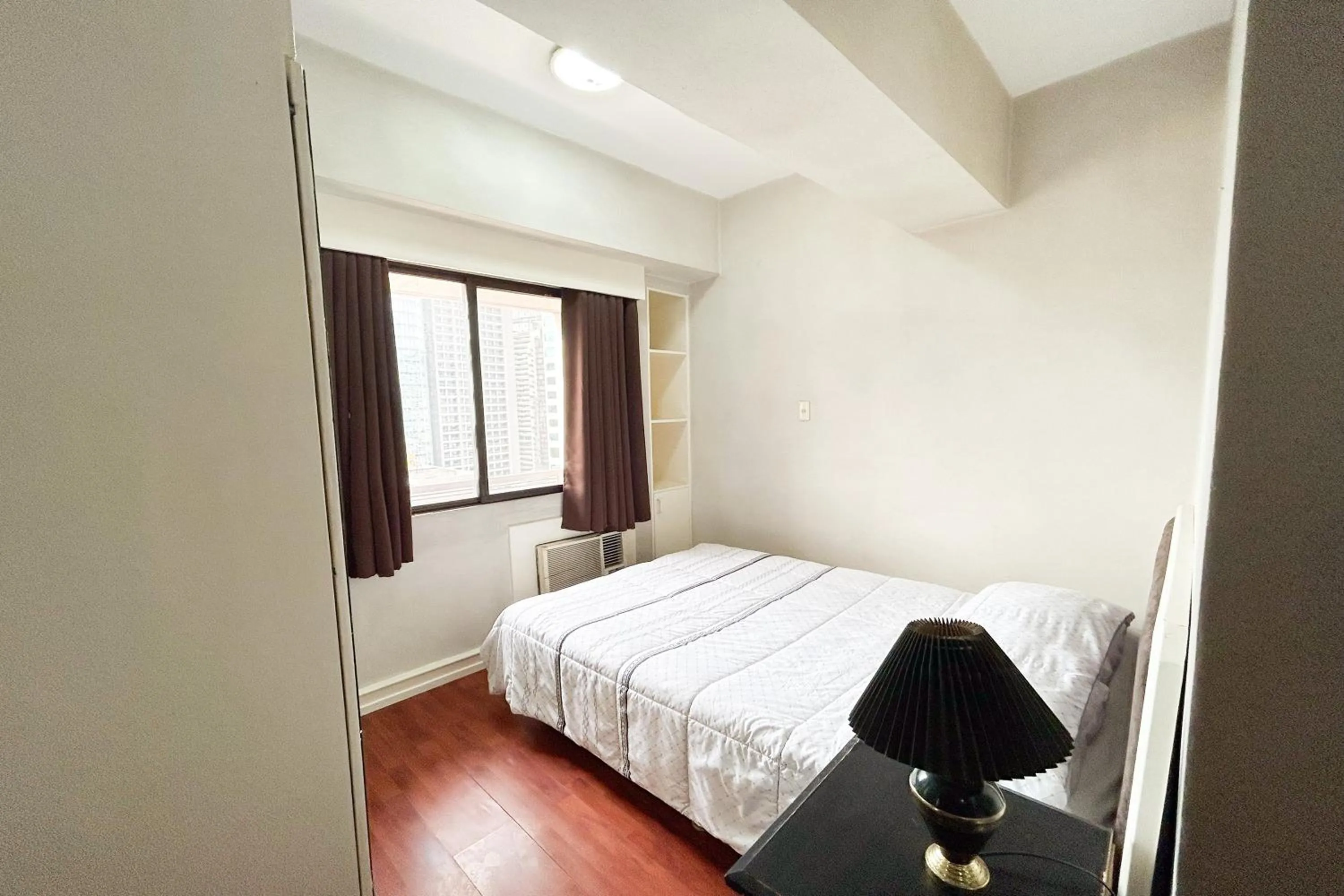 Bed in Sunette Tower Suites Makati