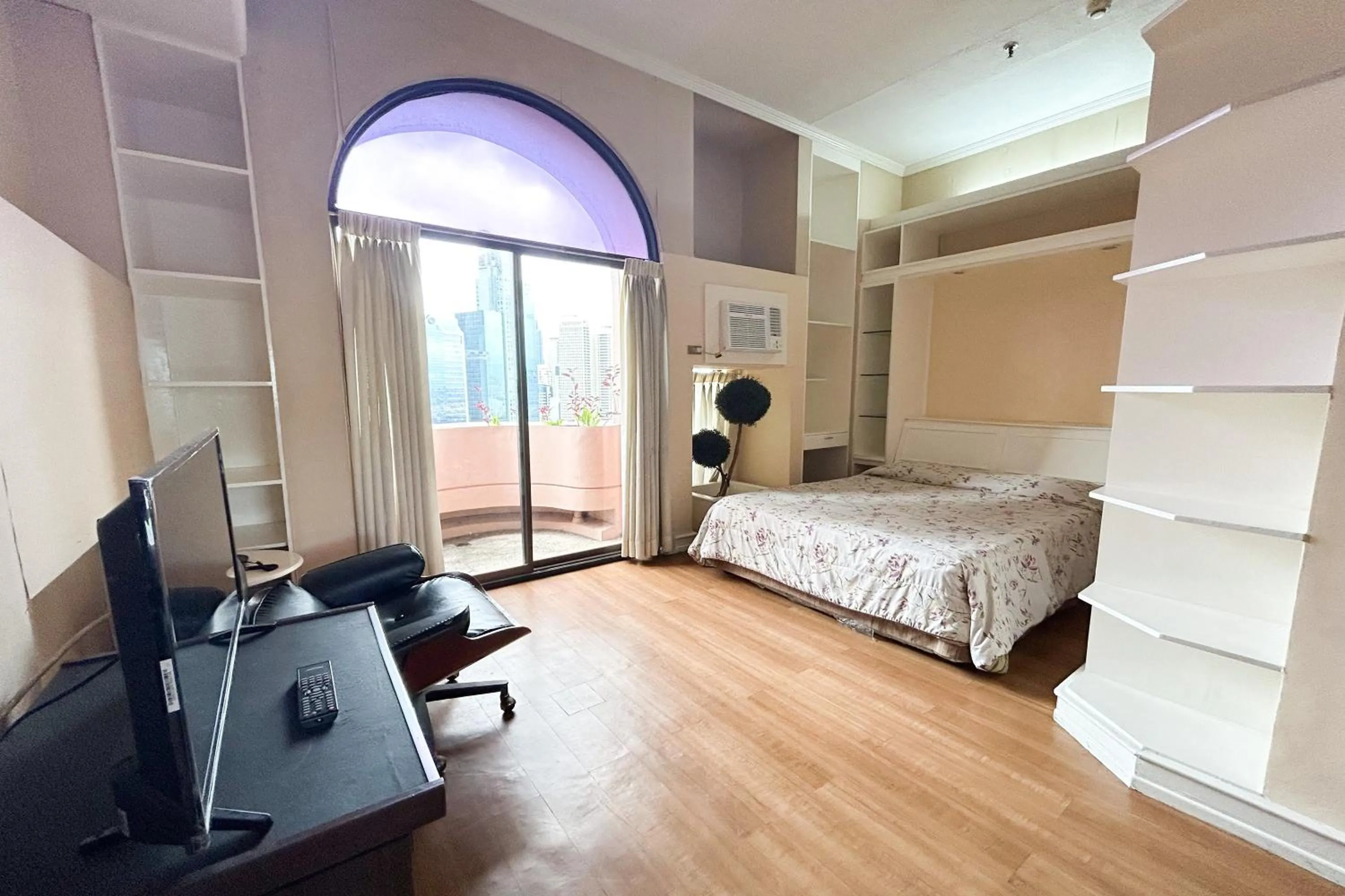 Bed in Sunette Tower Suites Makati