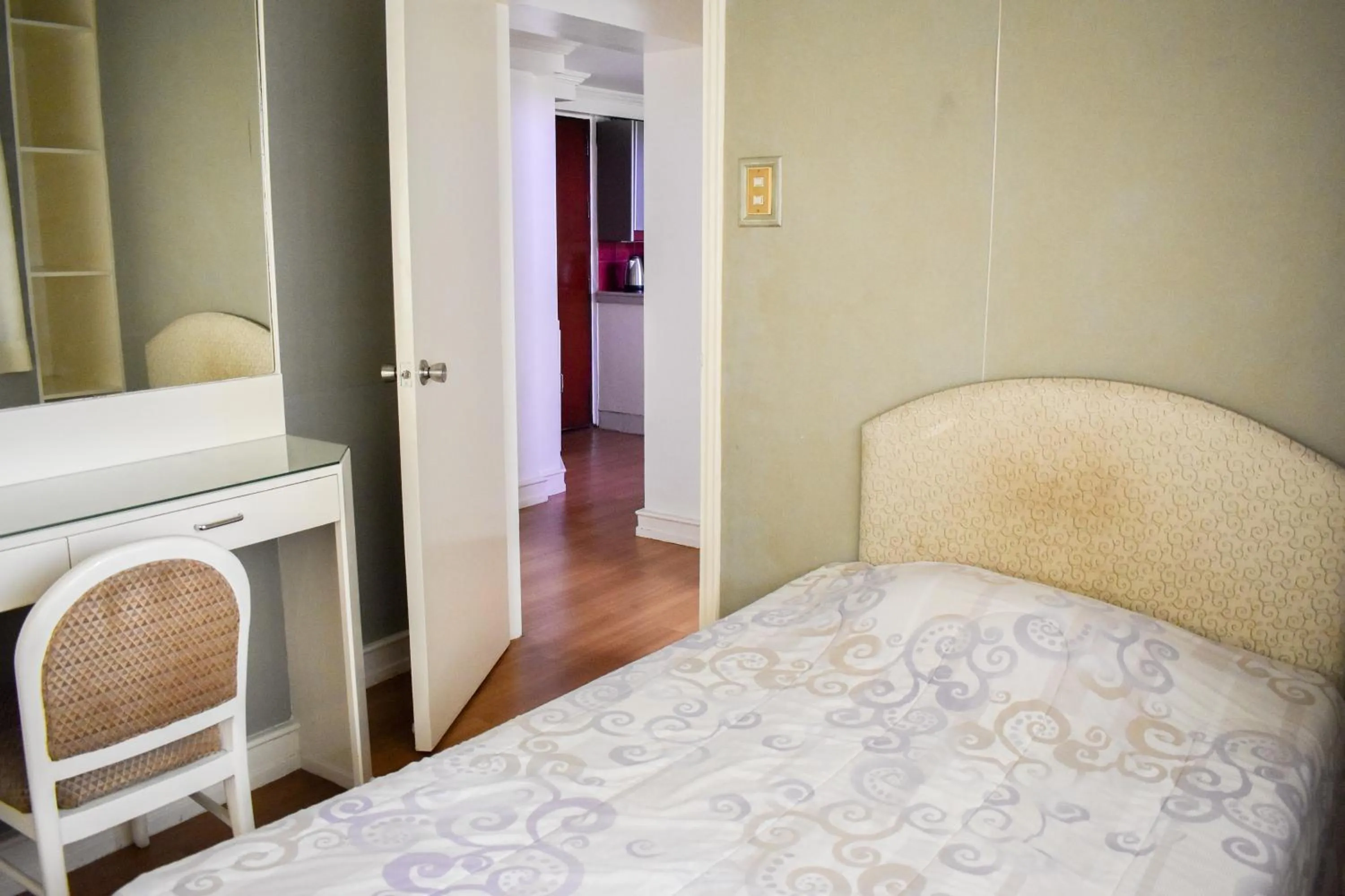 Bed in Sunette Tower Suites Makati