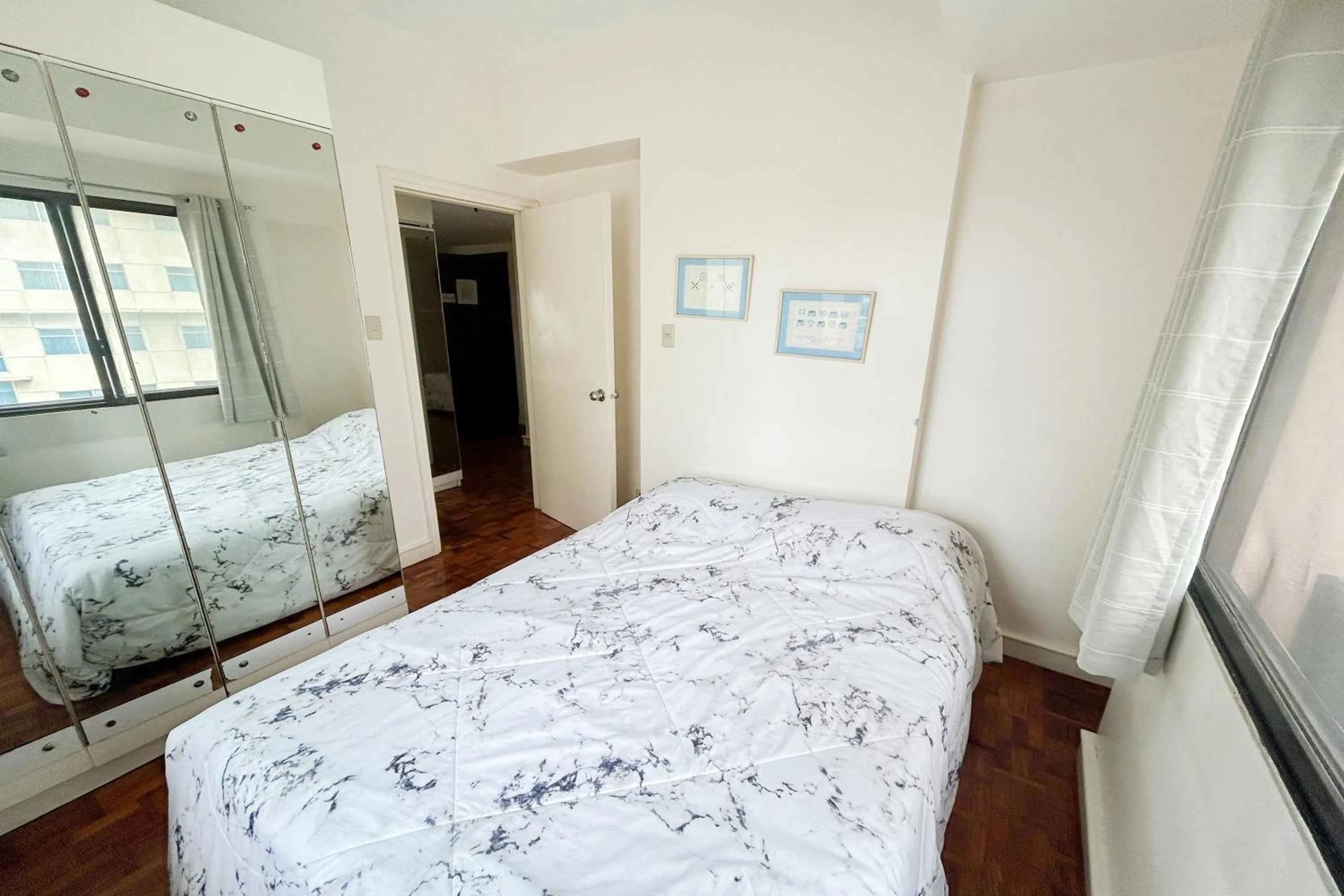 Bed in Sunette Tower Suites Makati