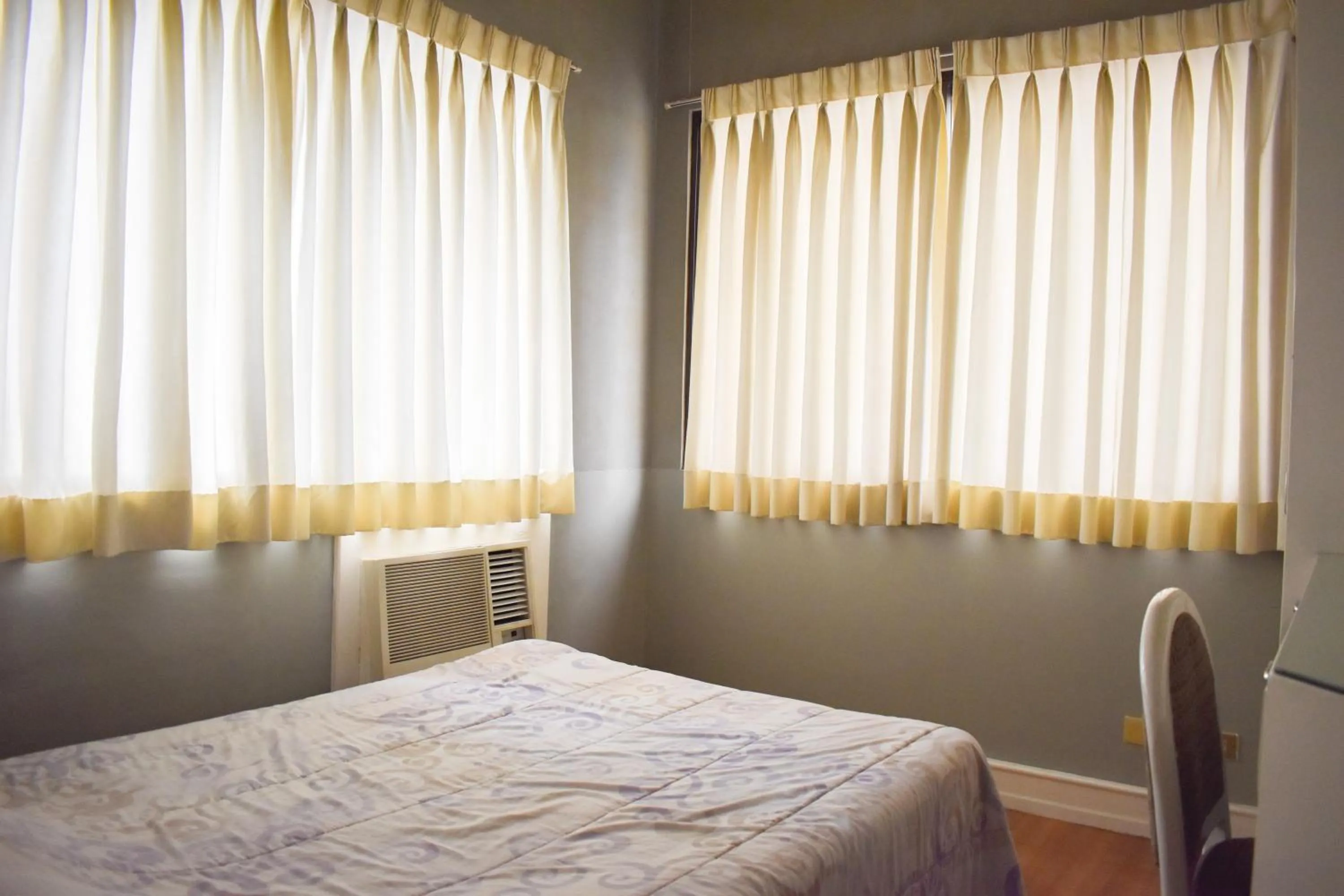 Bed in Sunette Tower Suites Makati