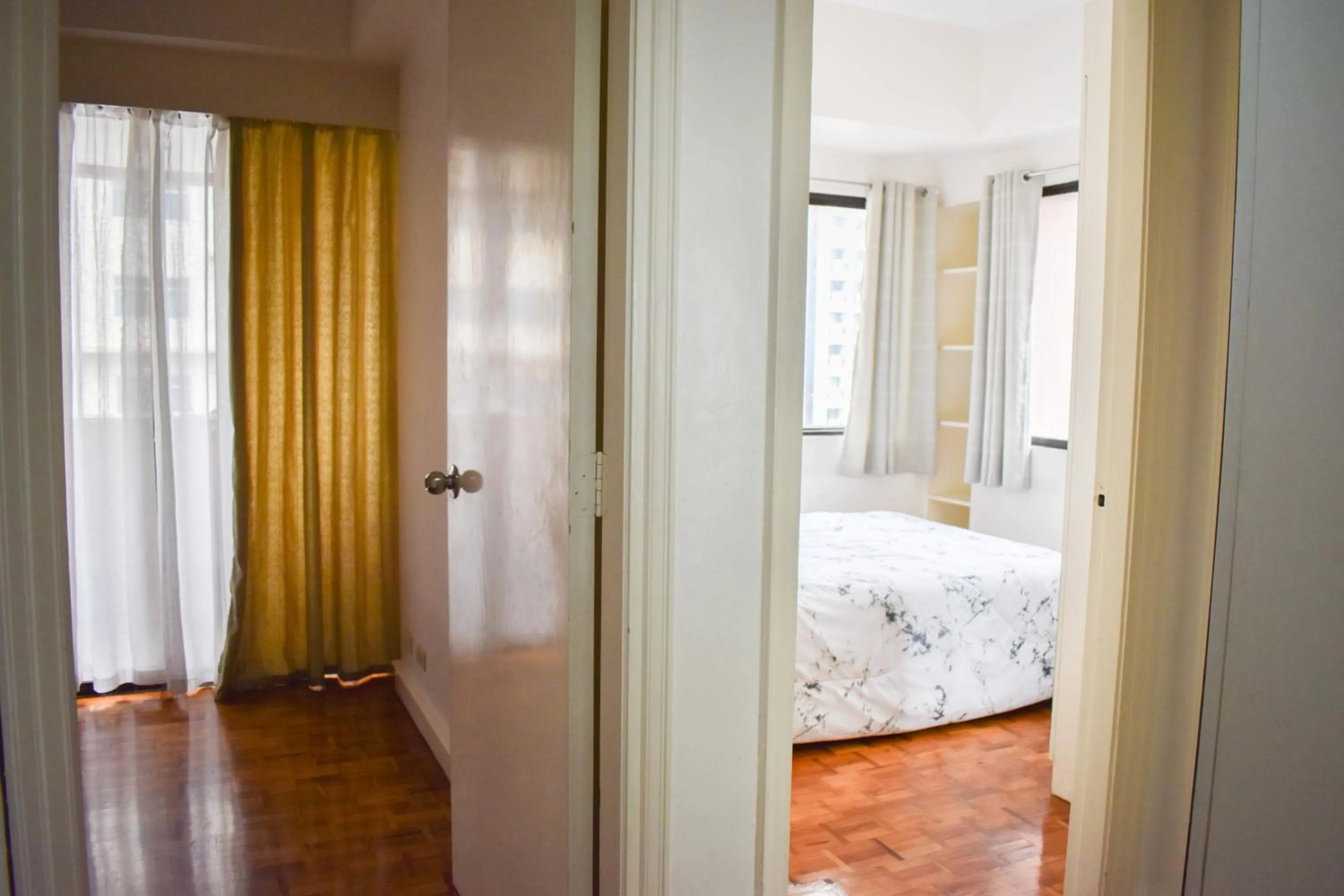 Bed in Sunette Tower Suites Makati