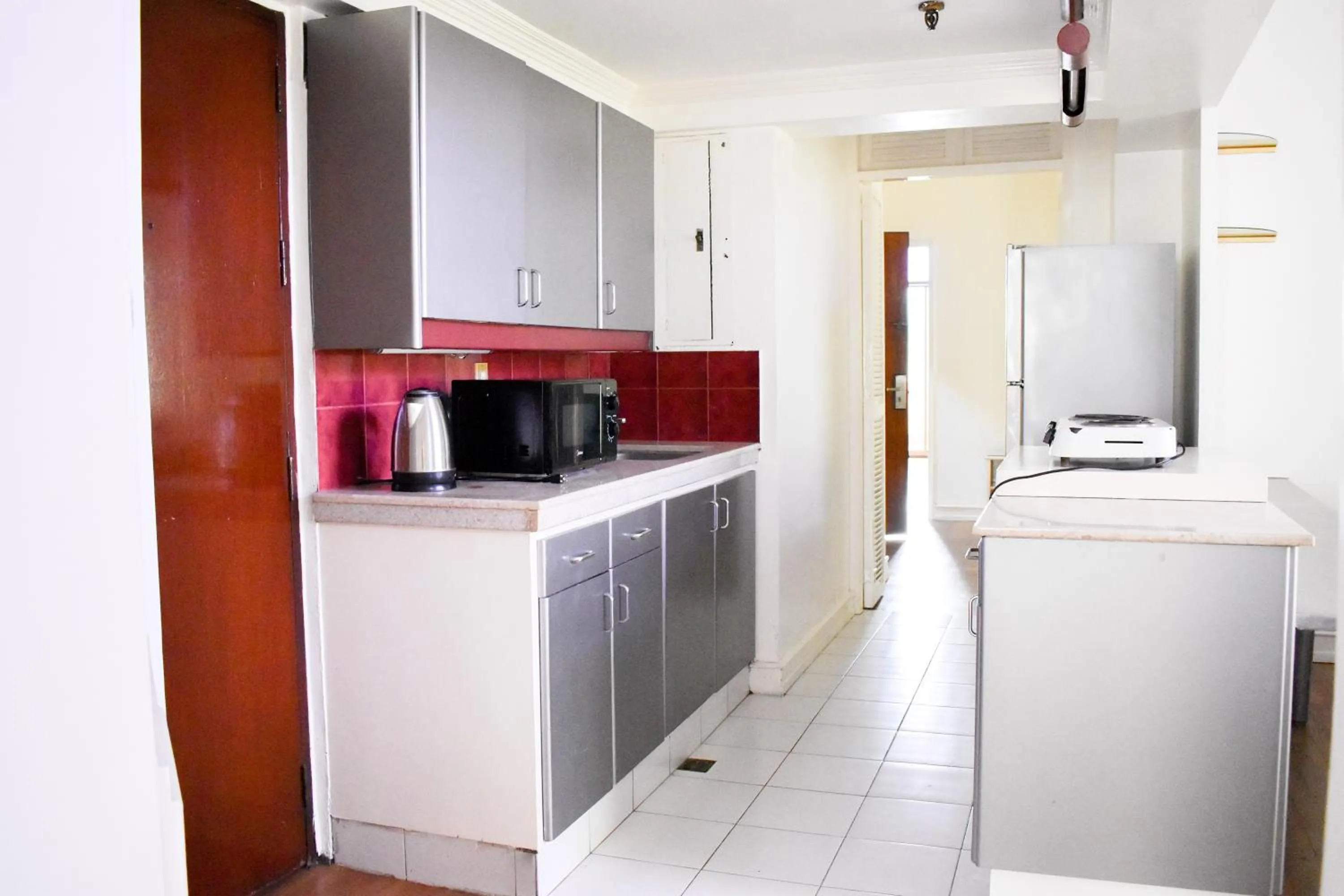 Kitchen or kitchenette in Sunette Tower Suites Makati