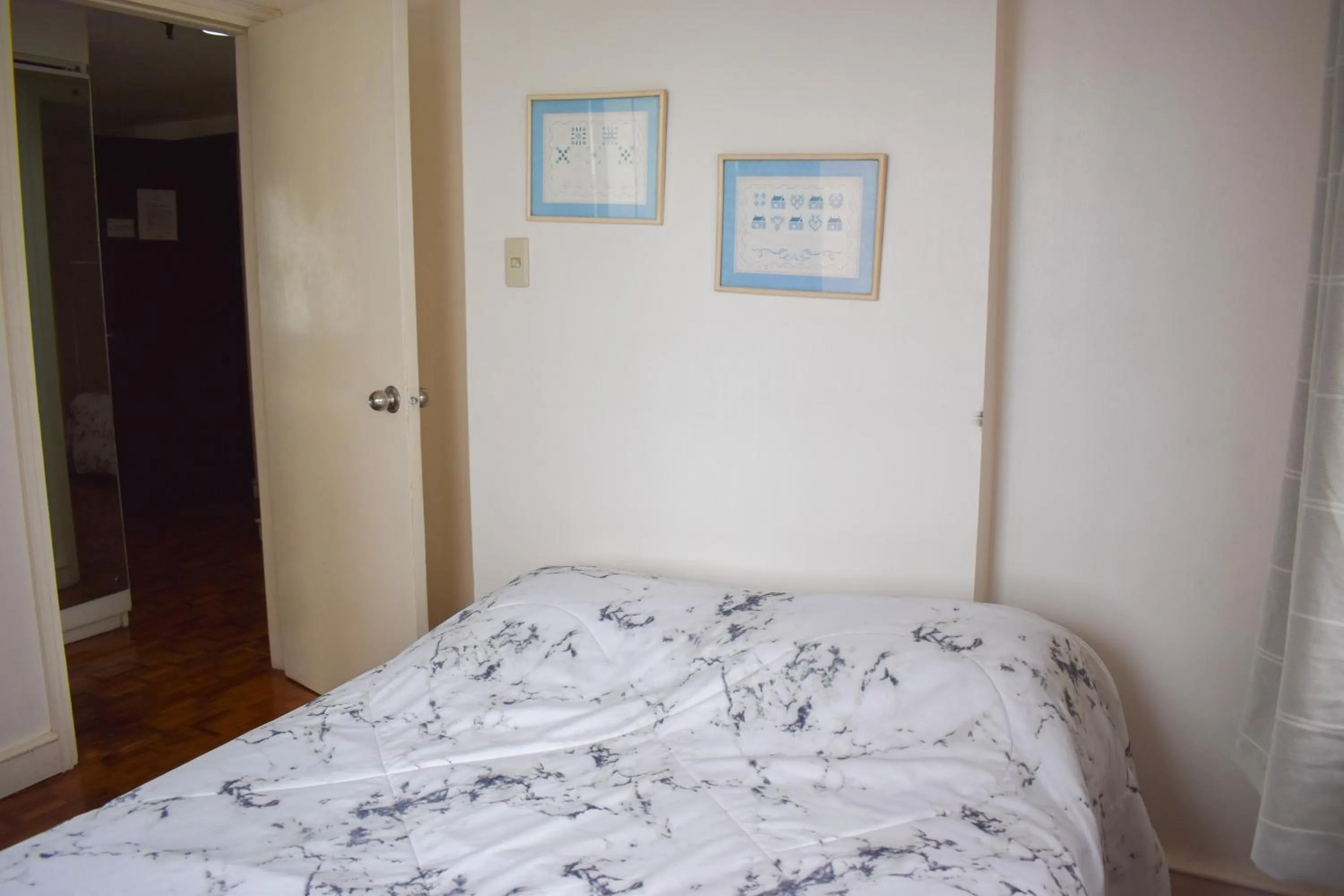 Bed in Sunette Tower Suites Makati