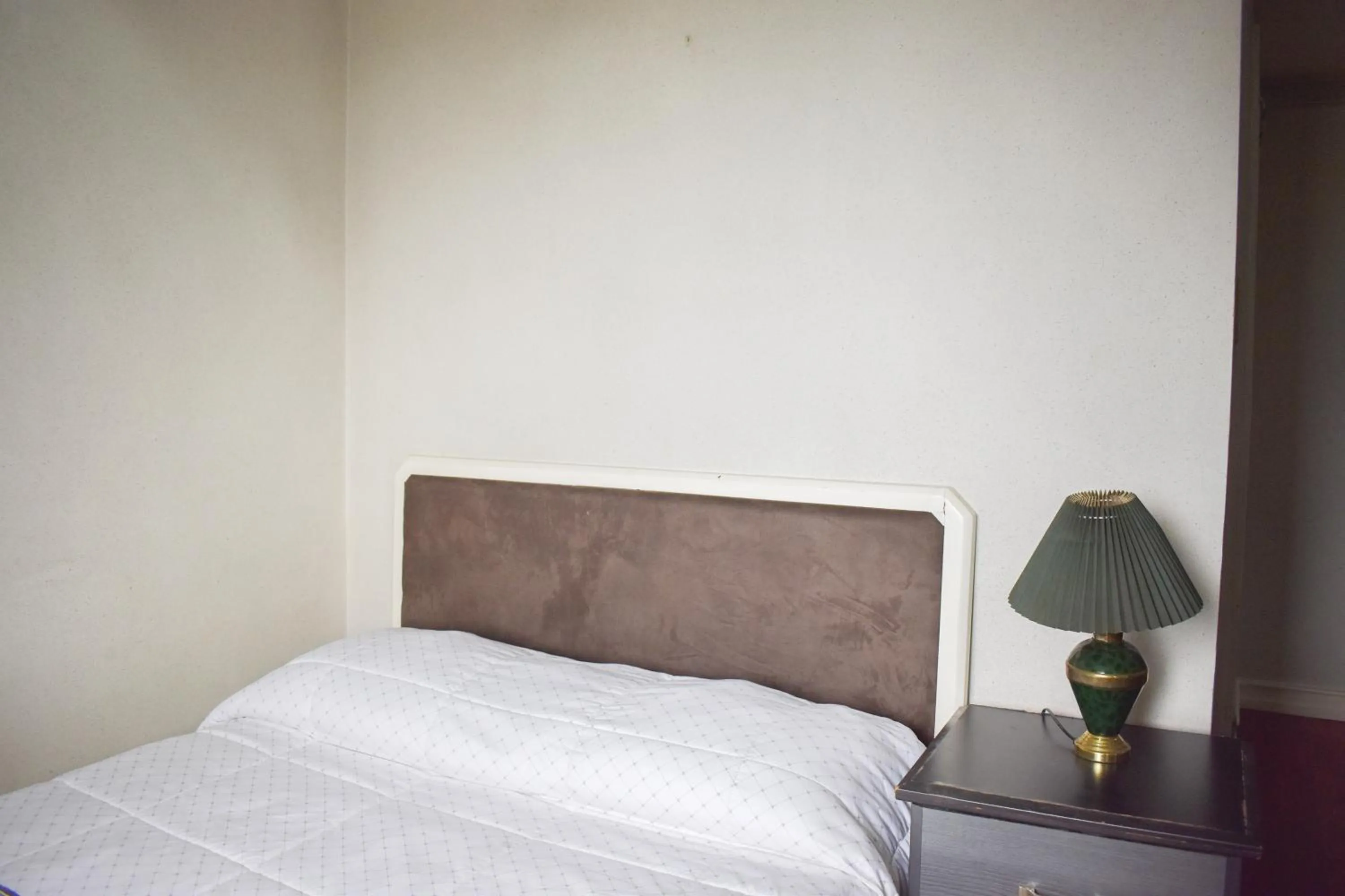 Bed in Sunette Tower Suites Makati