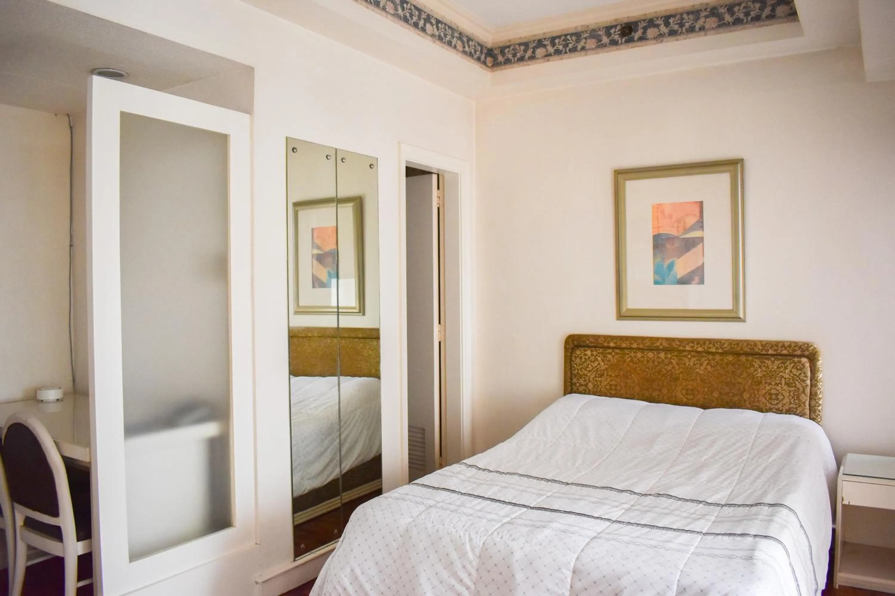 Bed in Sunette Tower Suites Makati