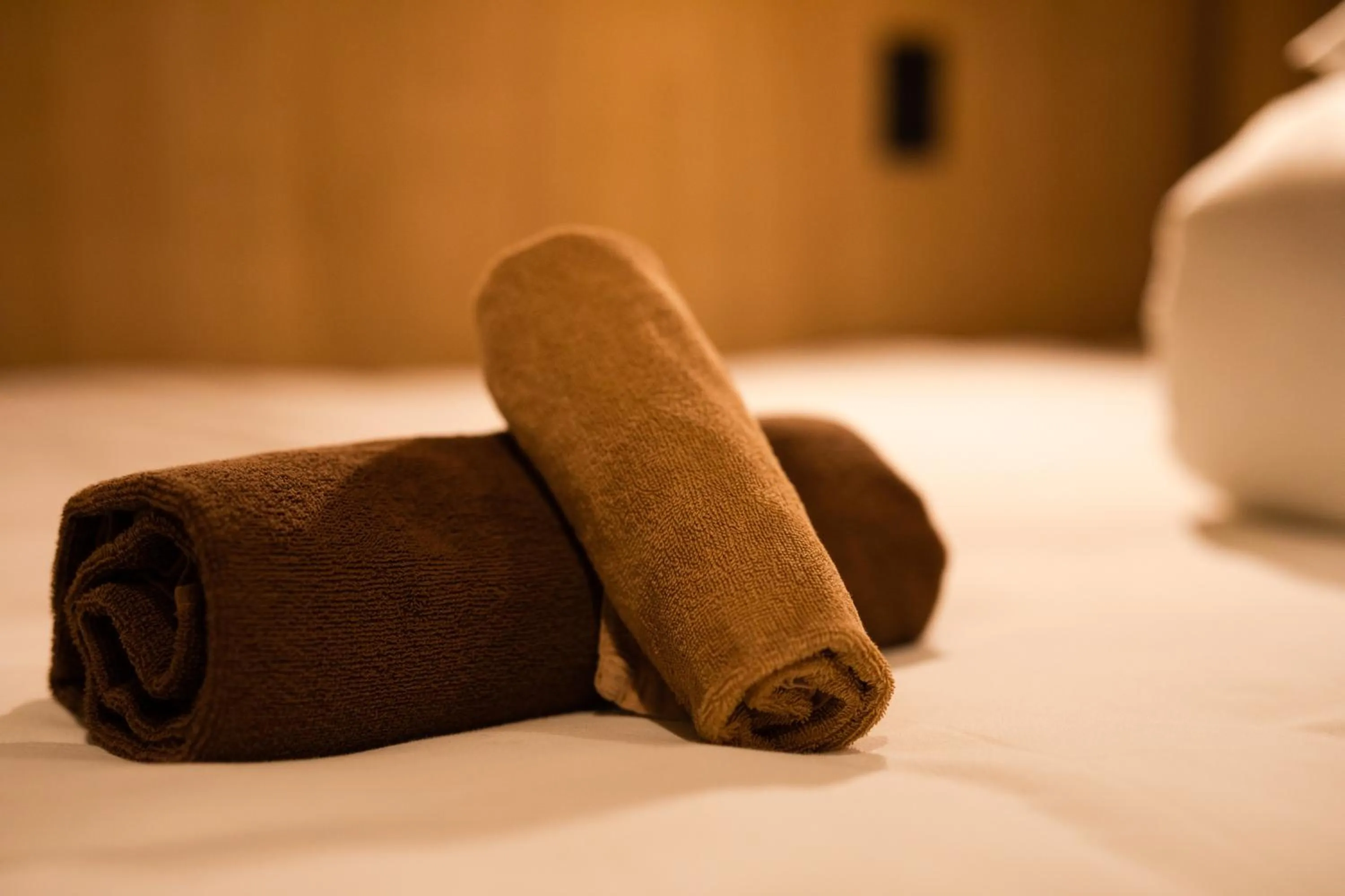 towels, Bed in THE BONDS HOTEL TOKYO