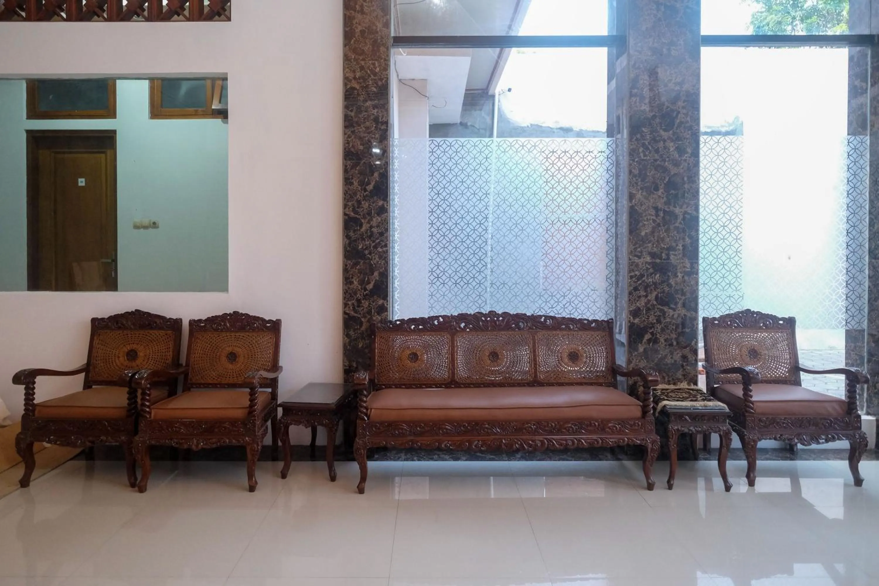 Seating area in RedDoorz Syariah near Alun Alun Temanggung