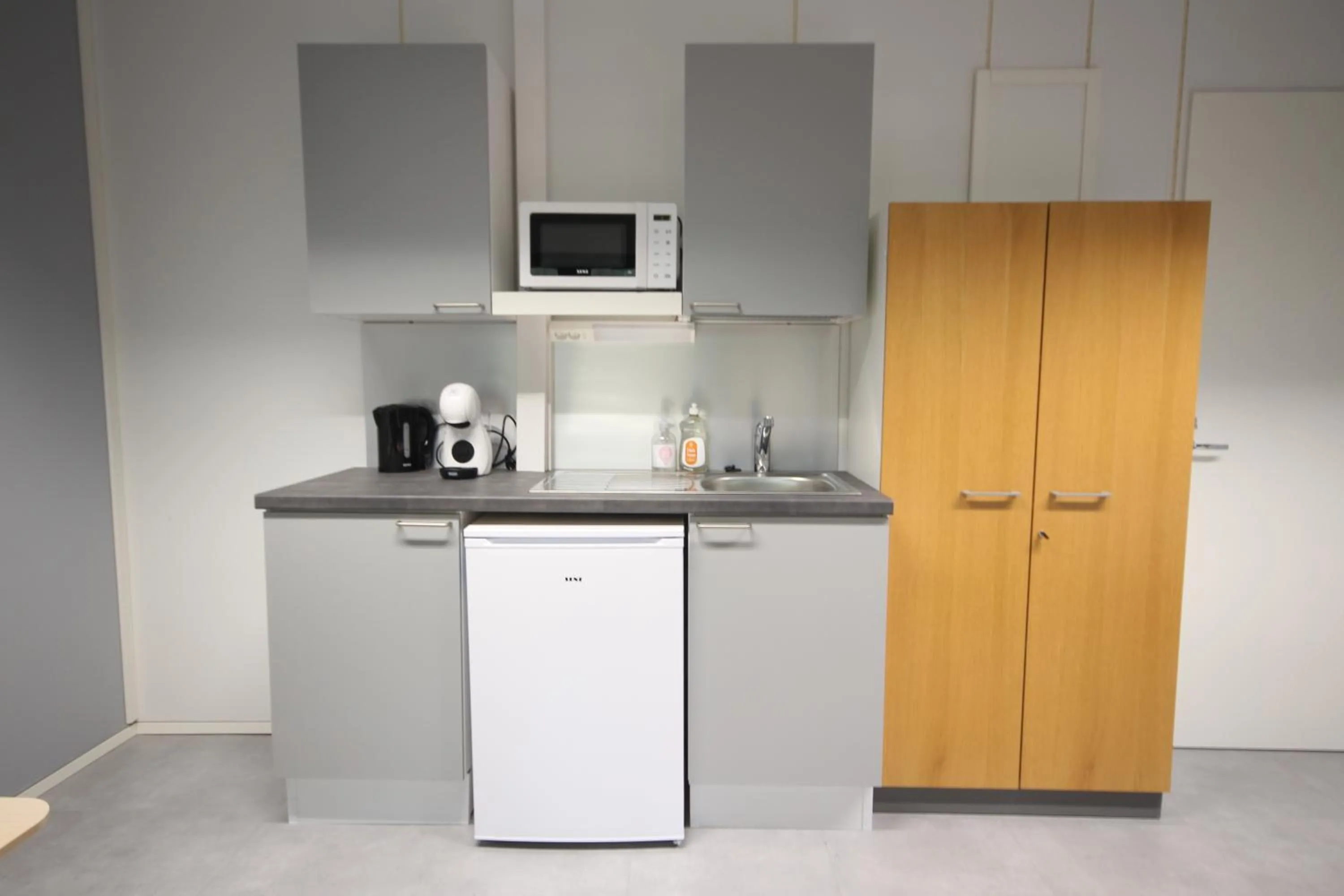 Kitchen or kitchenette in Forenom Hostel Espoo Kilo