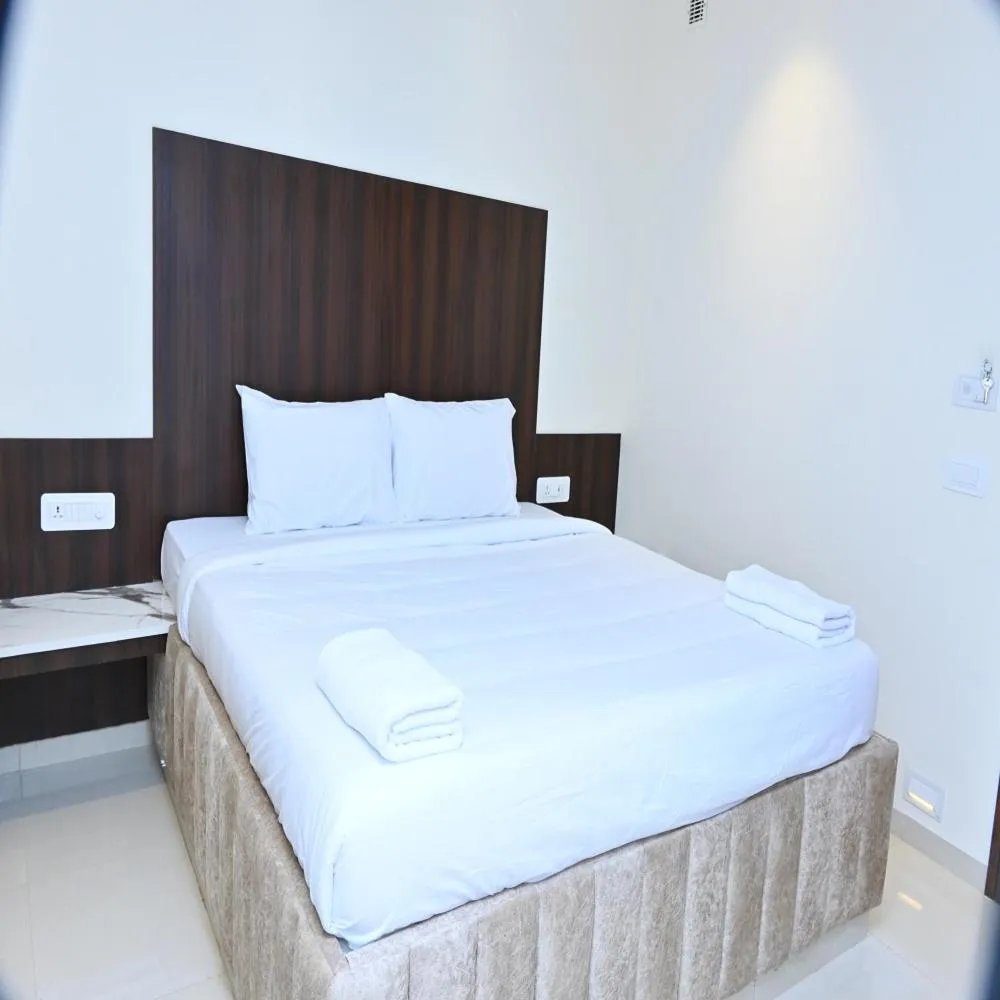 Bed in Grand Manor Suites