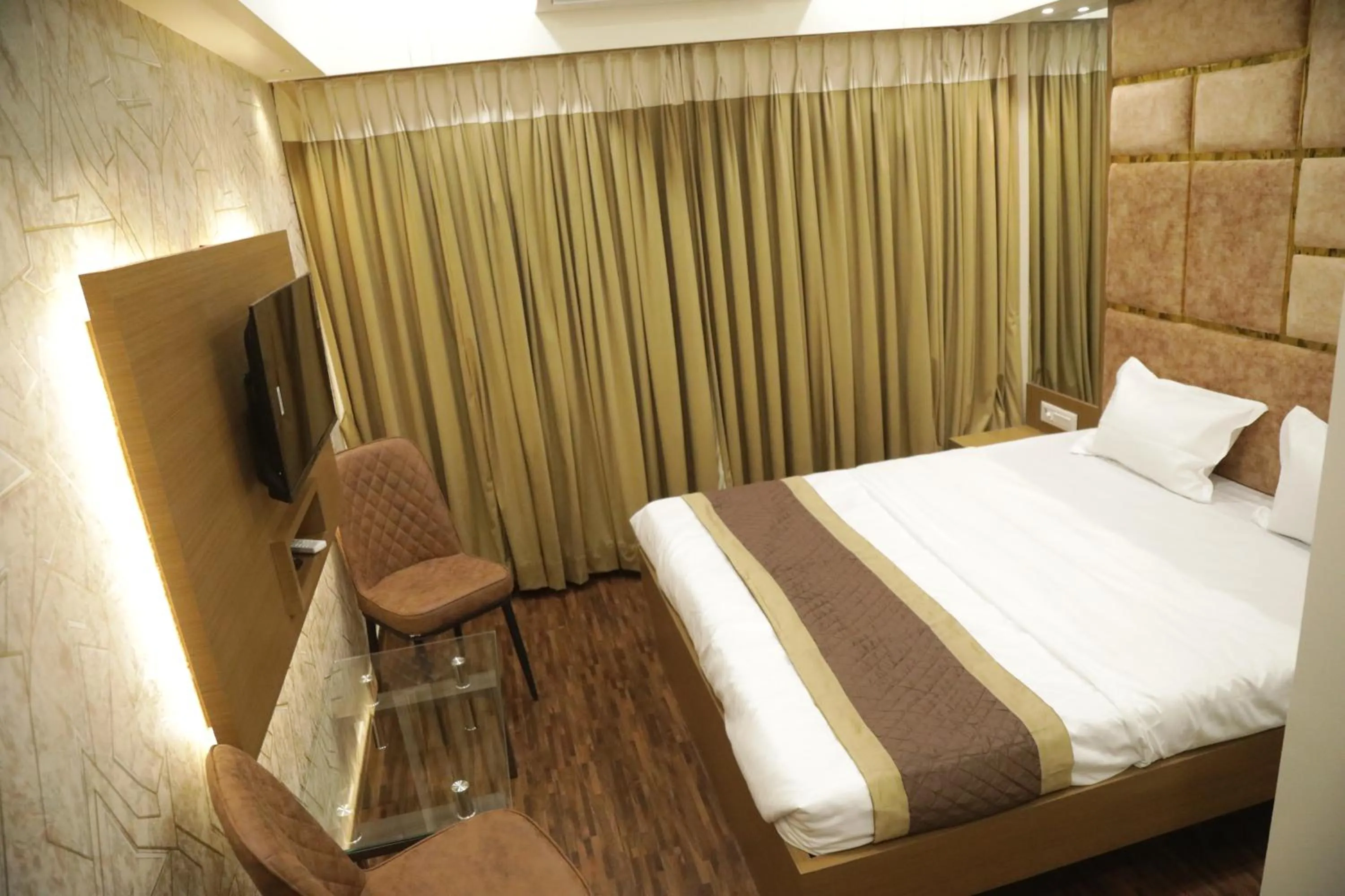 Bed in Hotel M Residency