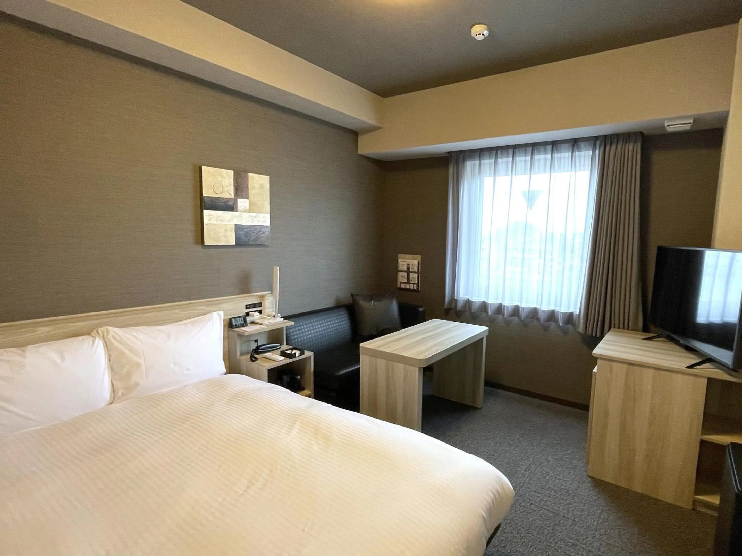 Photo of the whole room, Bed in Hotel Route Inn Ohi Takahama