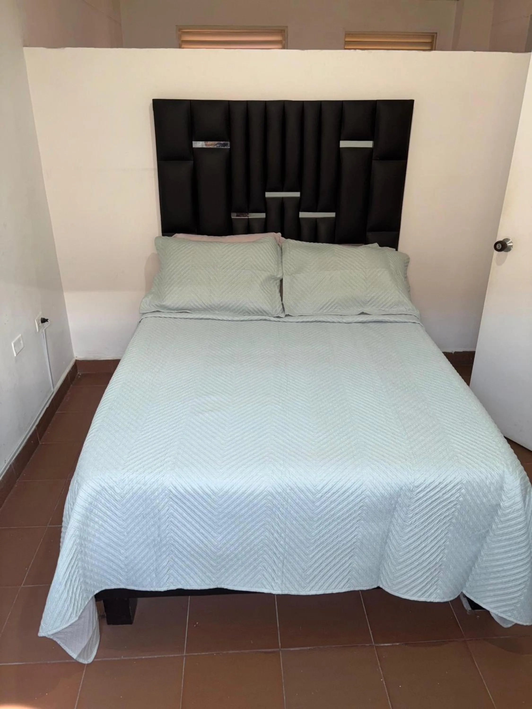 Bed in OUR HOME SAN ANTONIO