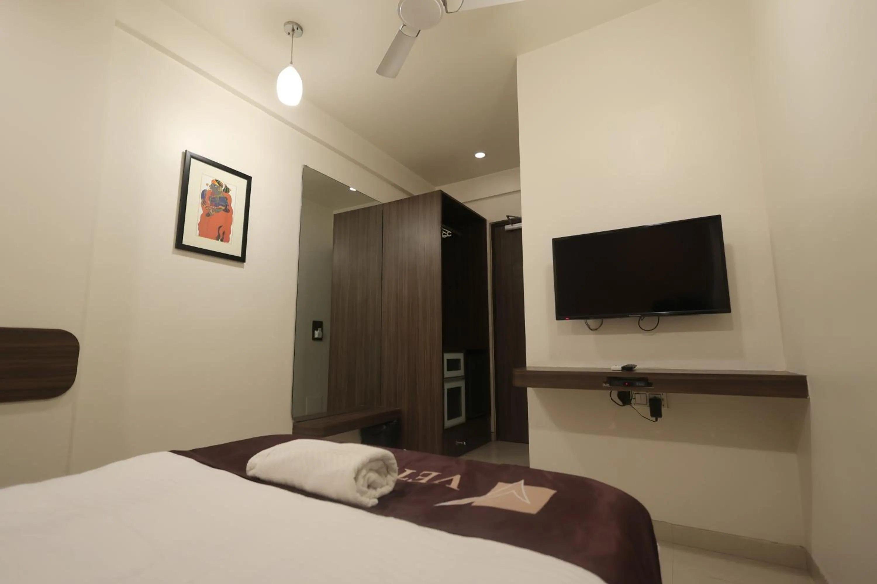 Bed in Hotel Vetro Inn