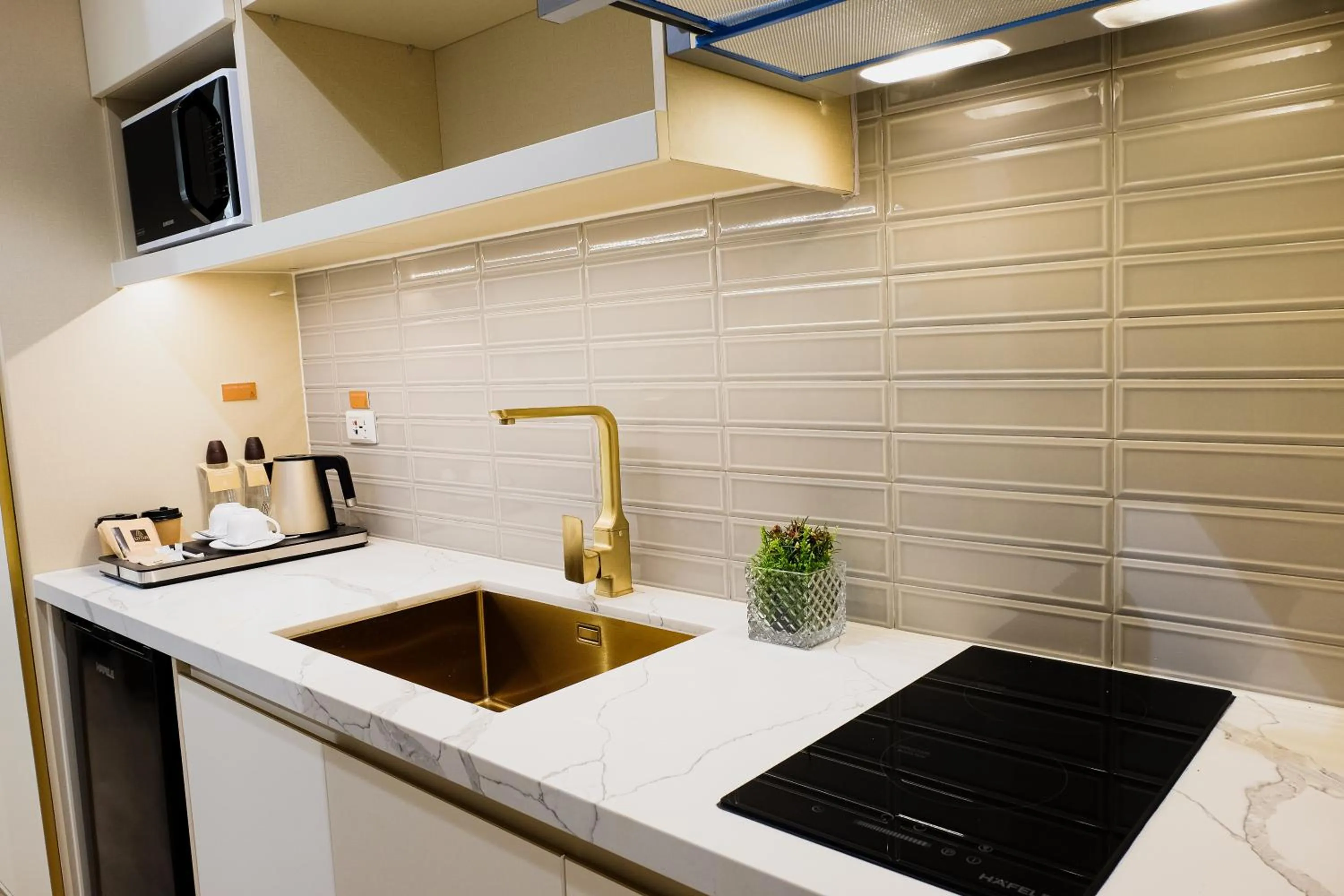 Kitchen or kitchenette in Uma Hotel and Residences