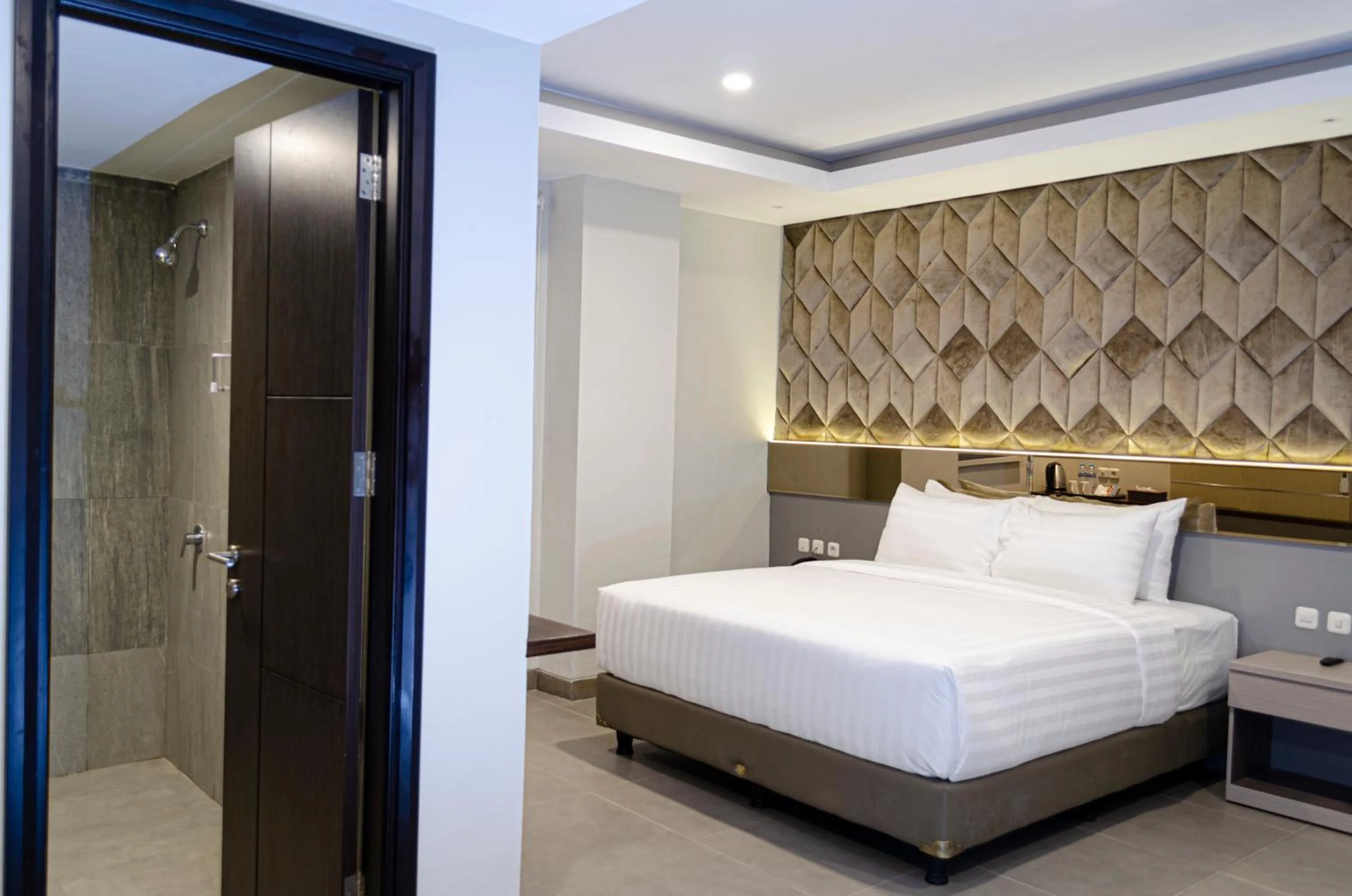 Bed in Arcadia Hotel Manado