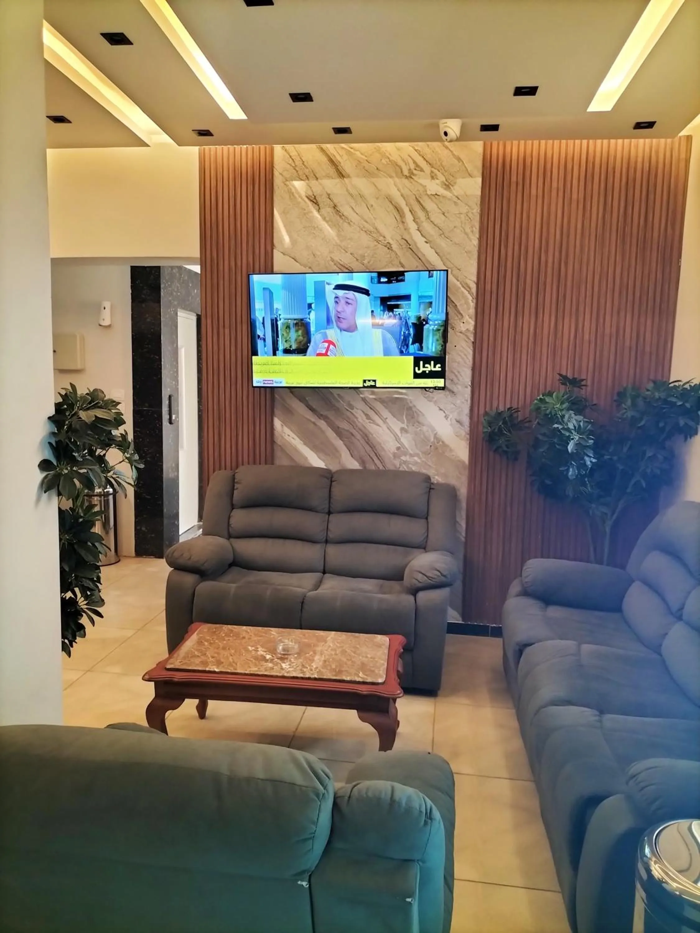 Communal lounge/ TV room in Sun and Sand Guest House