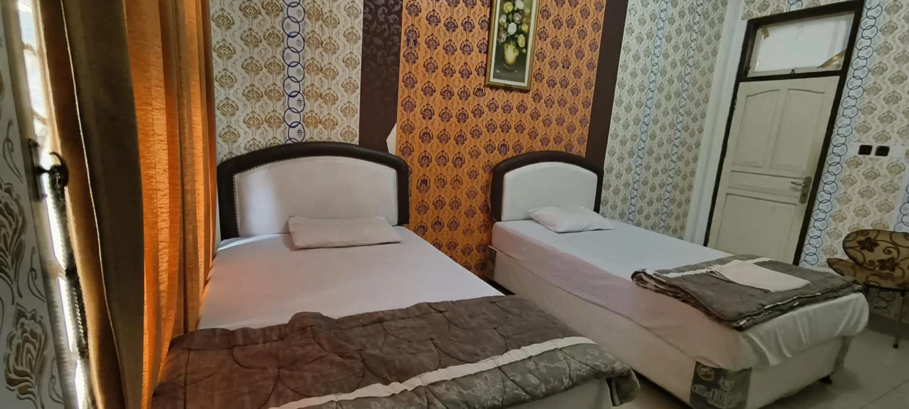 Bedroom, Bed in Hotel O Wisma Hamalau SyariahNearPulau Bromo Pedestrian Bridge