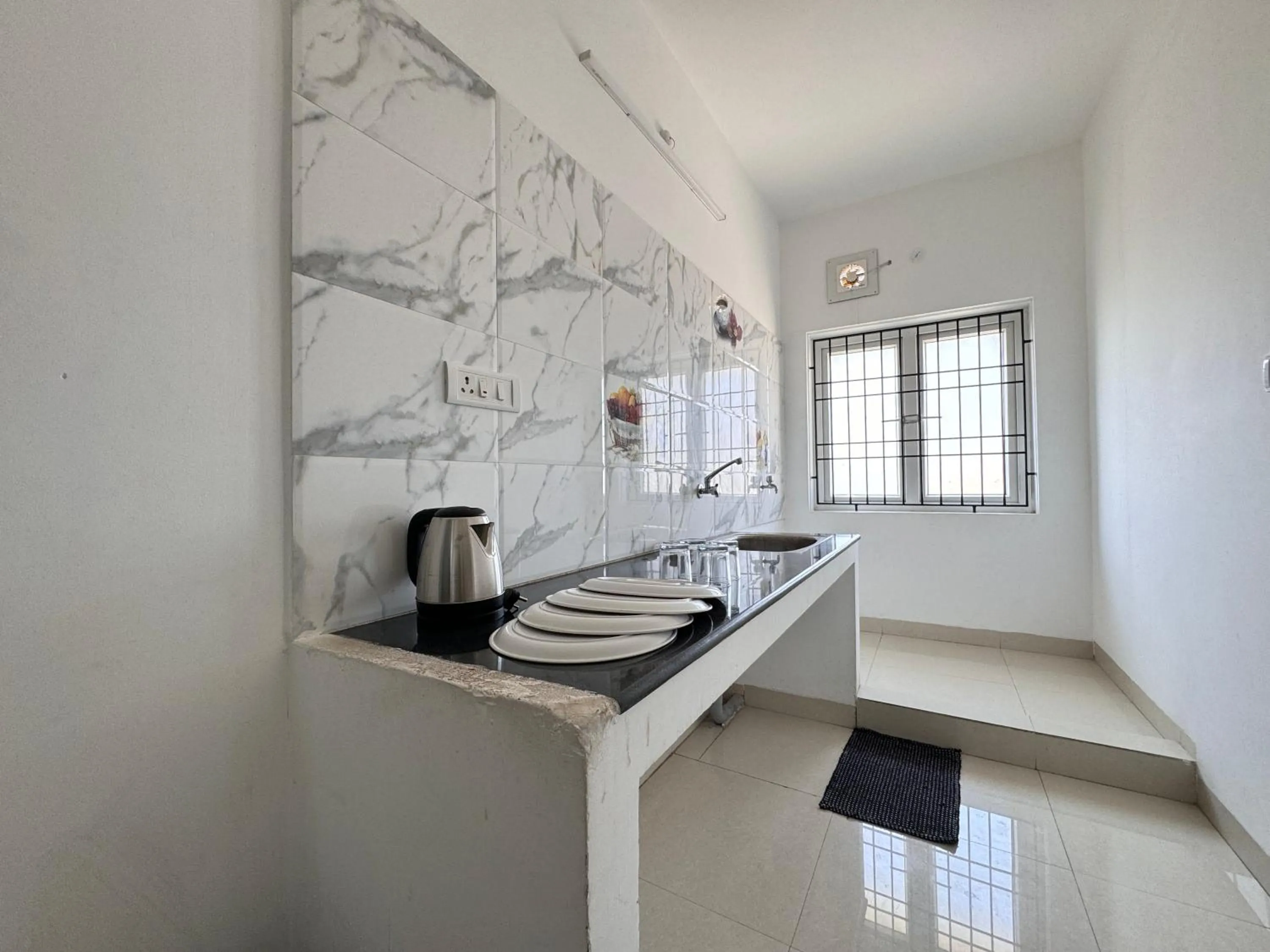 kitchen in Royal Beach Service Apartment