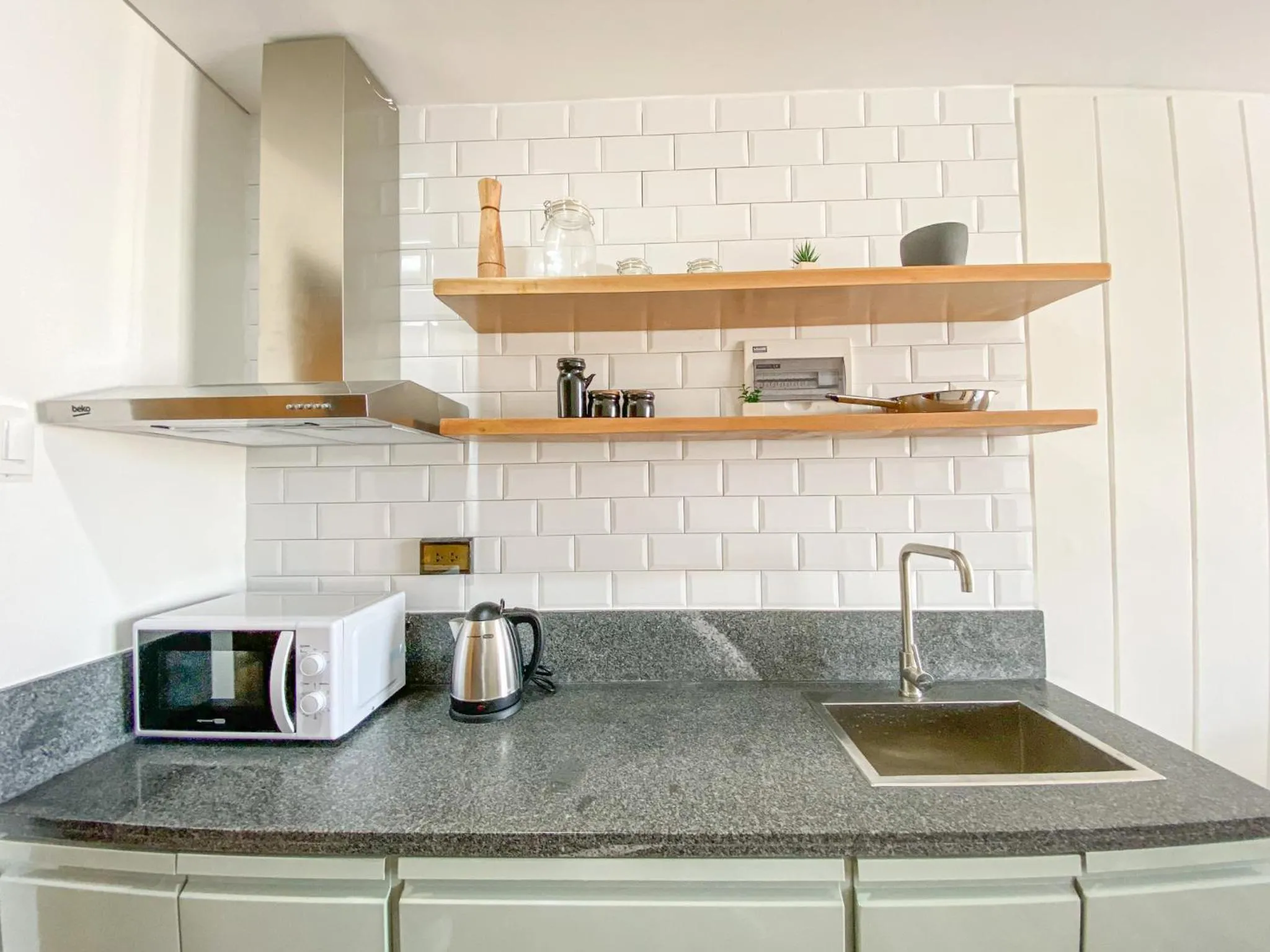 kitchen in Wesfame Suites