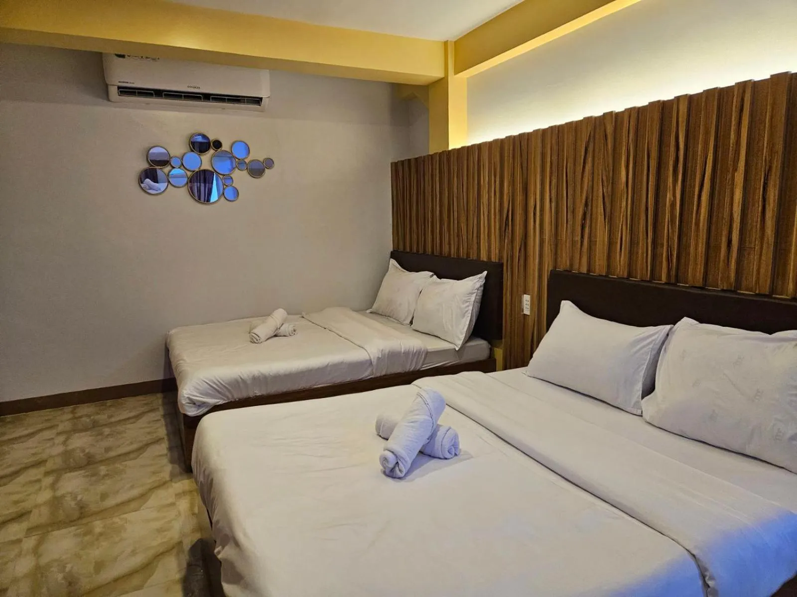 Bed in Grand Mercy Hotel