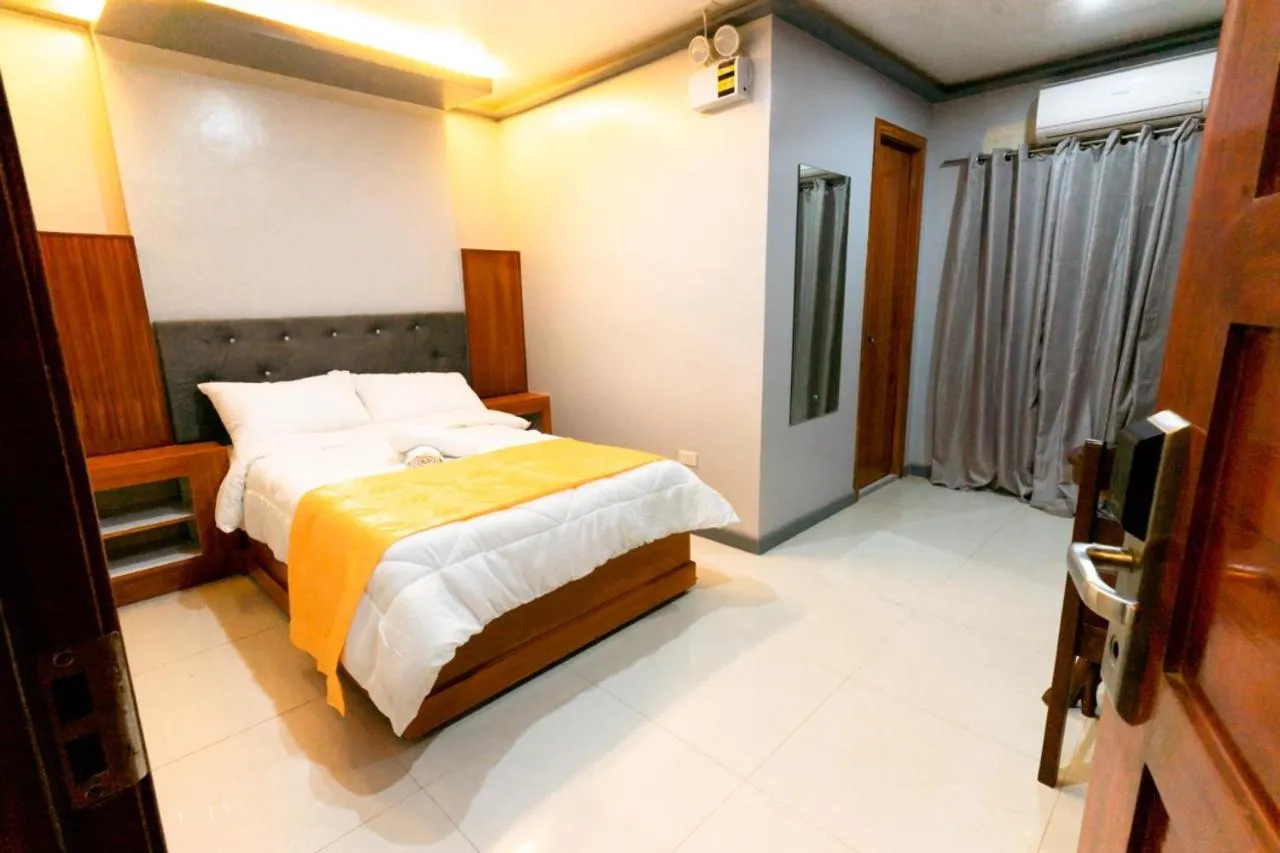 Bed in Grand Mercy Hotel