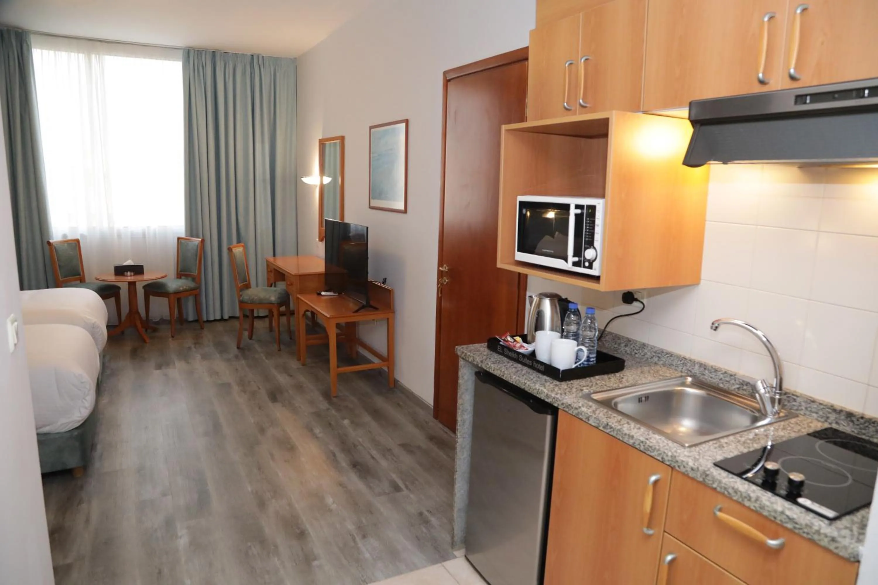 TV and multimedia in El Sheikh Suites Hotel